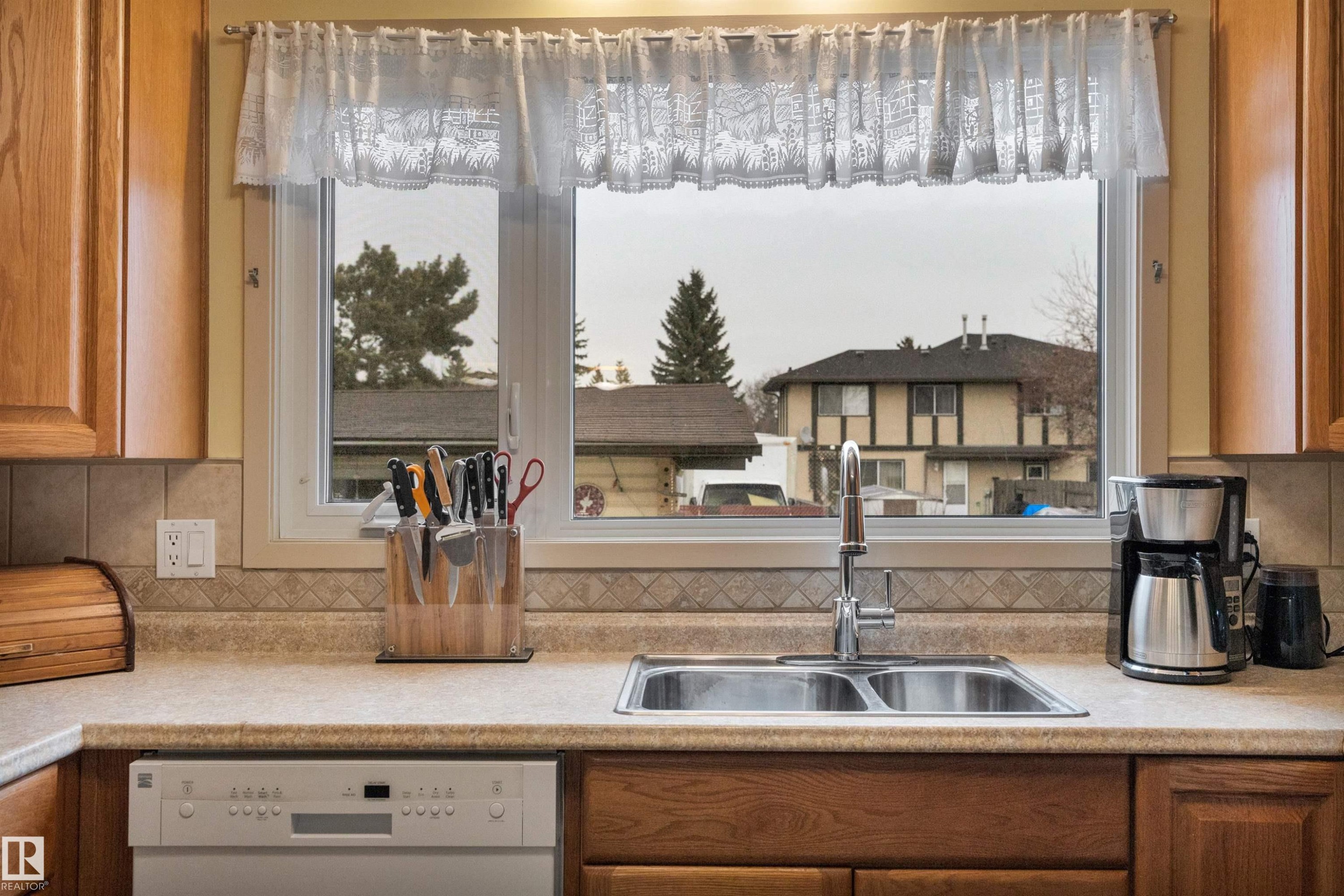 8649 27 Avenue, Edmonton, AB - Indoor Photo Showing Kitchen With Double Sink
