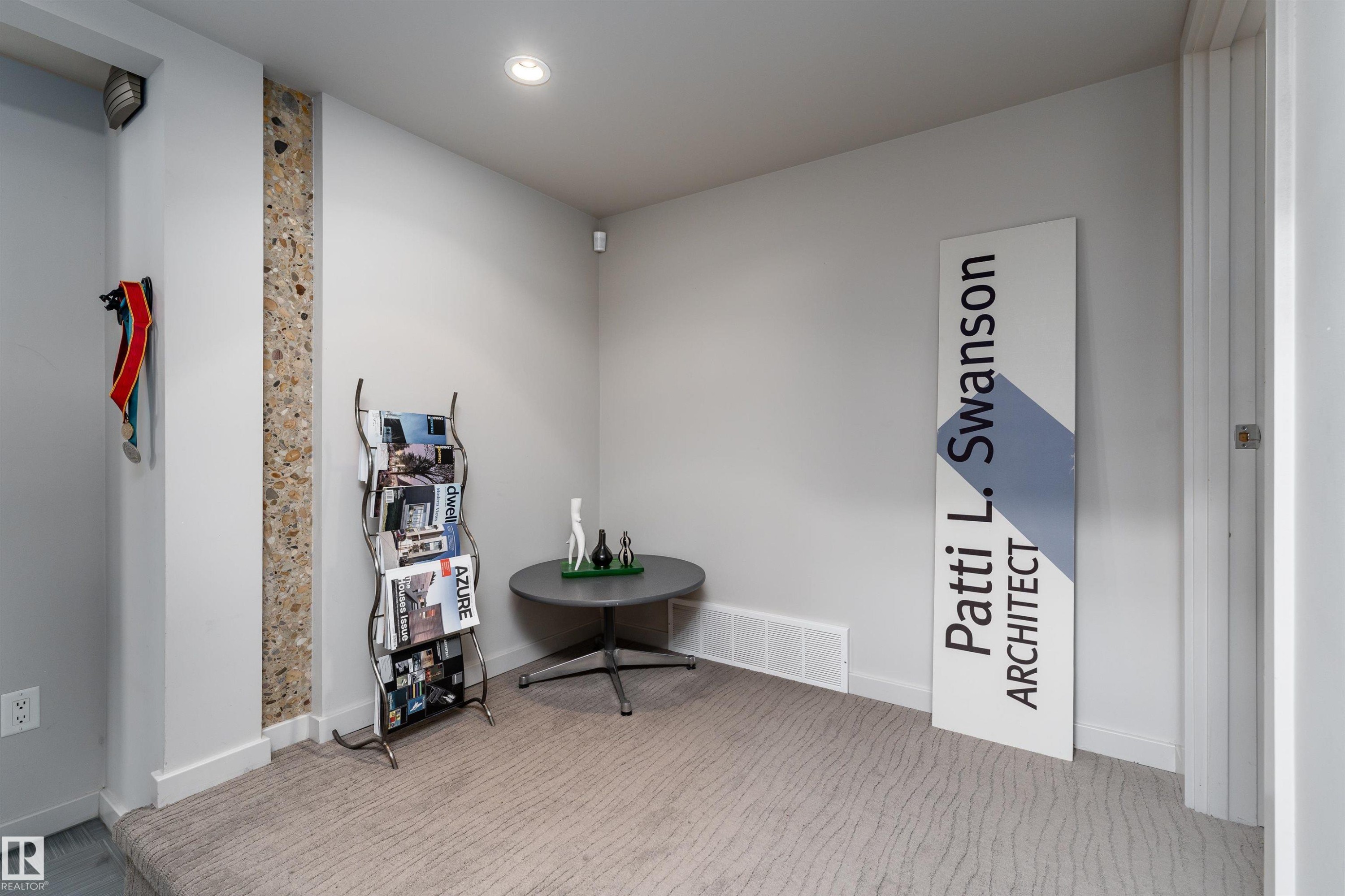 The room features light gray walls, a carpeted floor with a subtle pattern, and a recessed ceiling light - 9715 141 Street Nw, Edmonton, AB - Indoor Photo Showing Other Room
