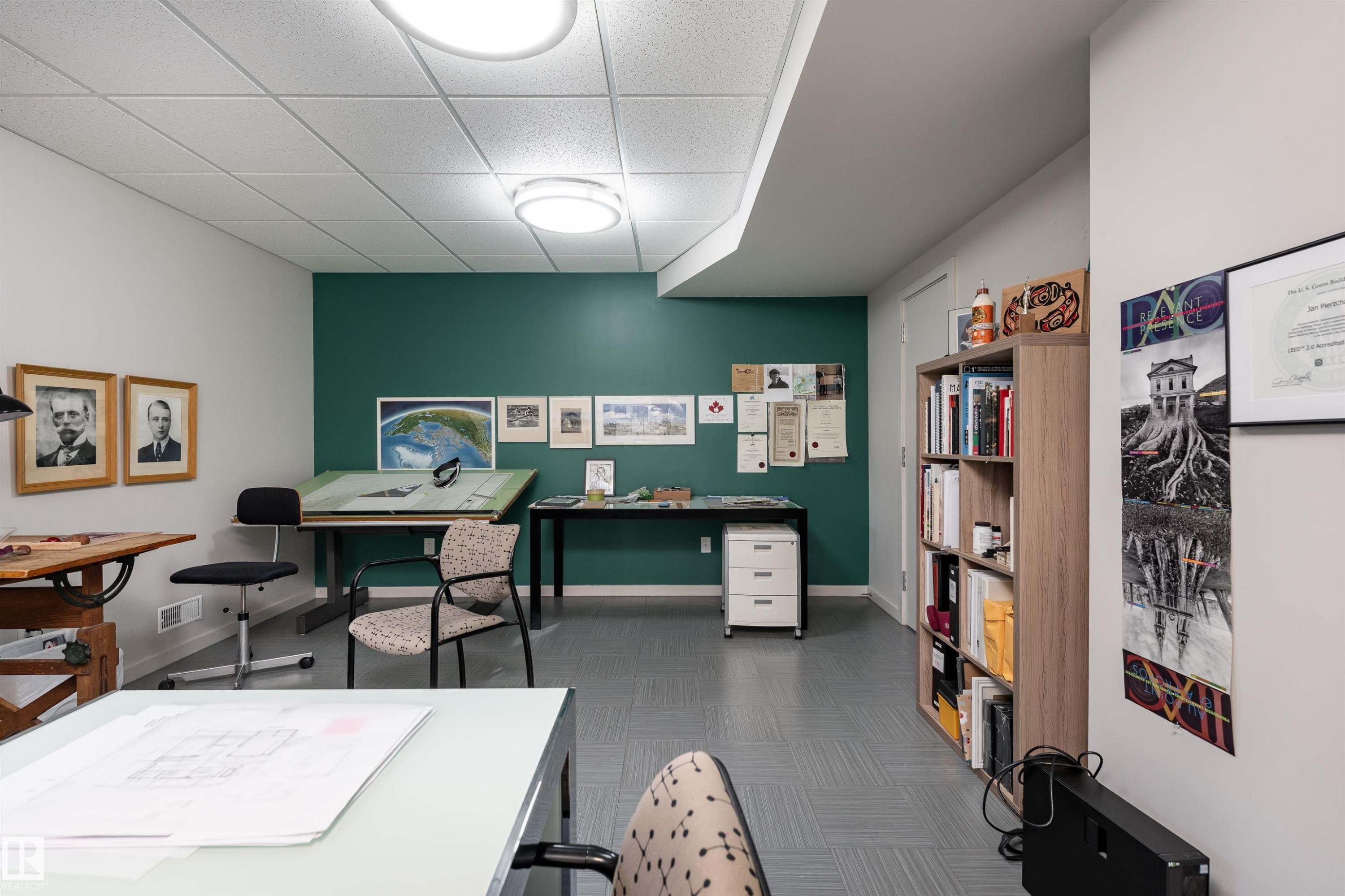 Versatile room with a dark teal accent wall, recessed lighting, and light-colored ceiling tiles - 9715 141 Street Nw, Edmonton, AB - Indoor