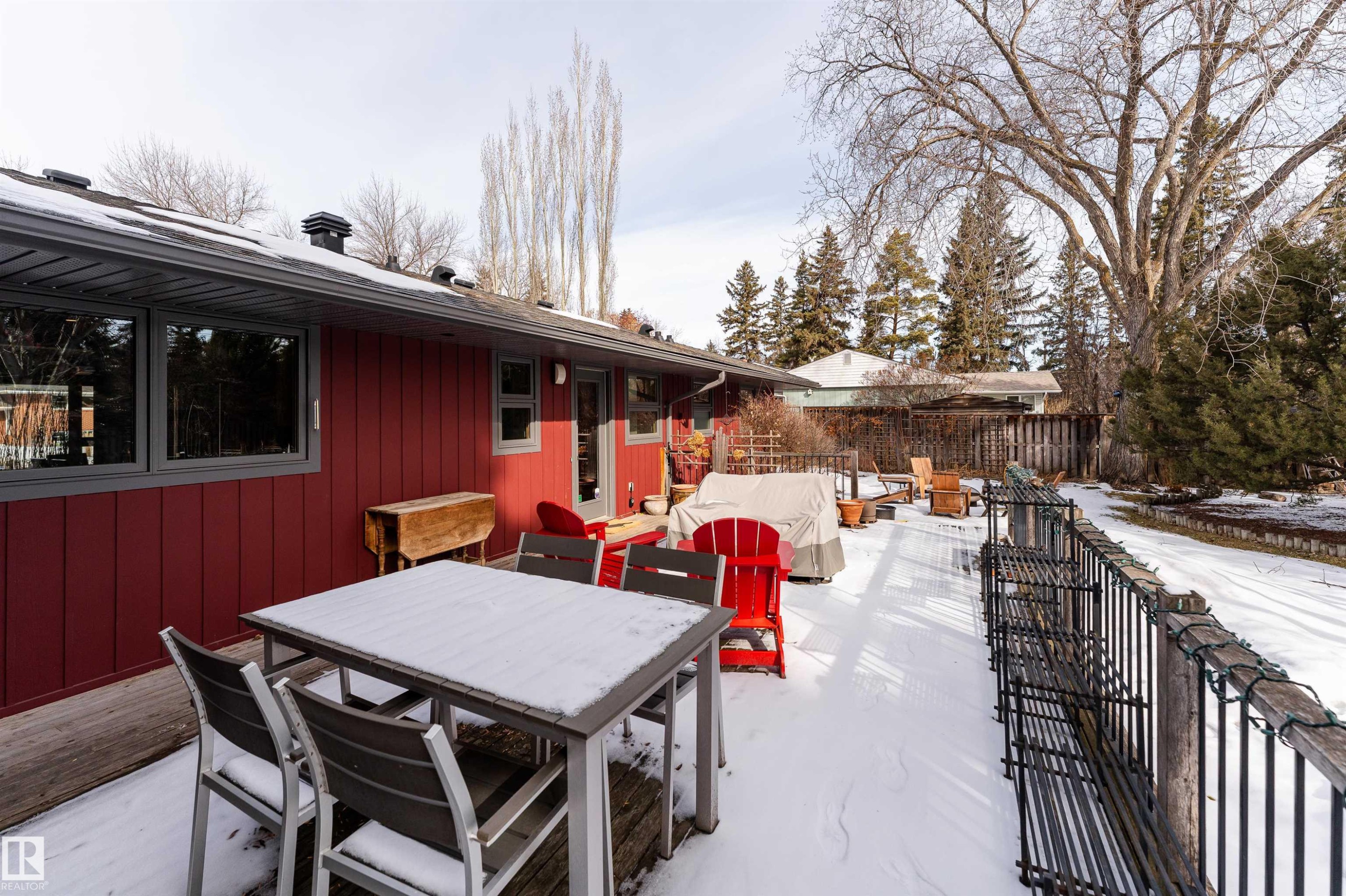 The property features a spacious rear deck, offering ample outdoor living space - 9715 141 Street Nw, Edmonton, AB - Outdoor With Deck Patio Veranda