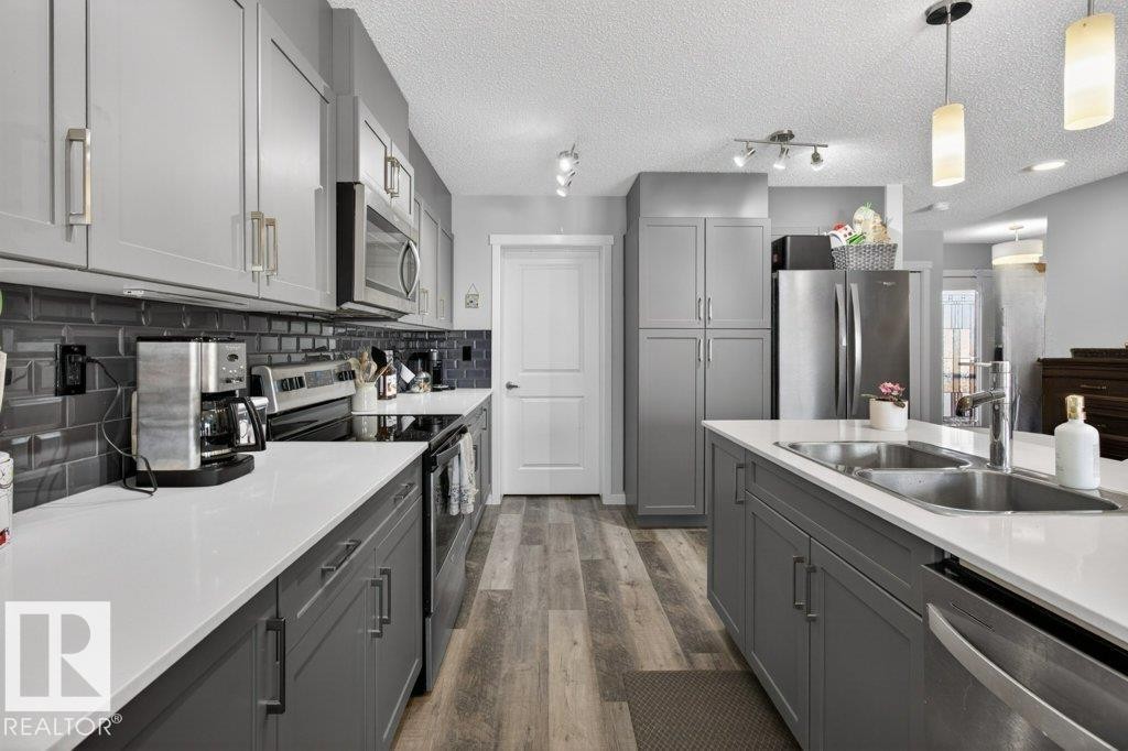 29 Harness Link, Ardrossan, AB - Indoor Photo Showing Kitchen With Double Sink With Upgraded Kitchen