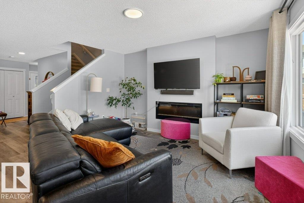 29 Harness Link, Ardrossan, AB - Indoor Photo Showing Living Room With Fireplace