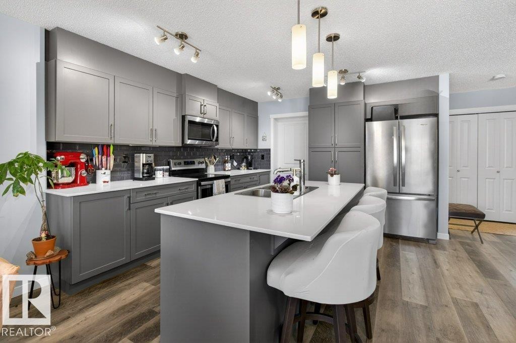 29 Harness Link, Ardrossan, AB - Indoor Photo Showing Kitchen With Stainless Steel Kitchen With Double Sink With Upgraded Kitchen