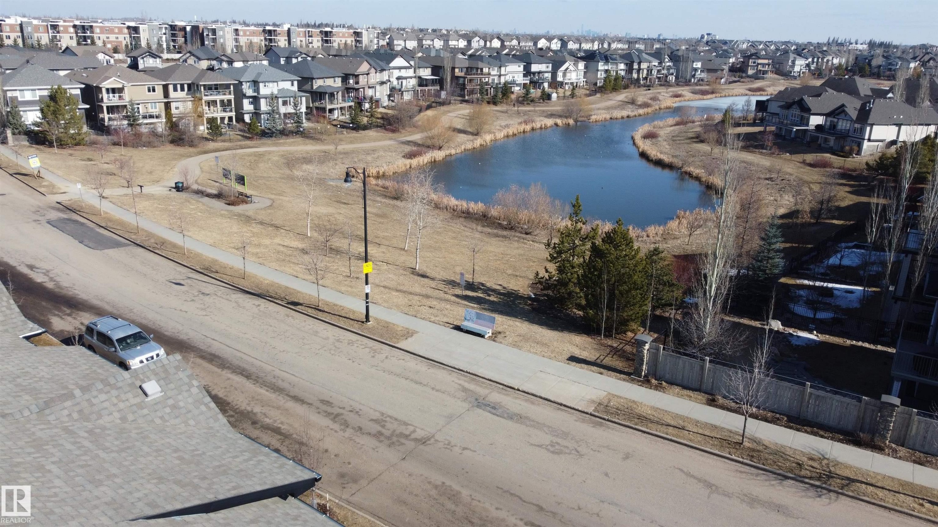 Overlooking a serene pond with surrounding pathways and established residences - 1403 Cunningham Drive, Edmonton, AB - Outdoor With View