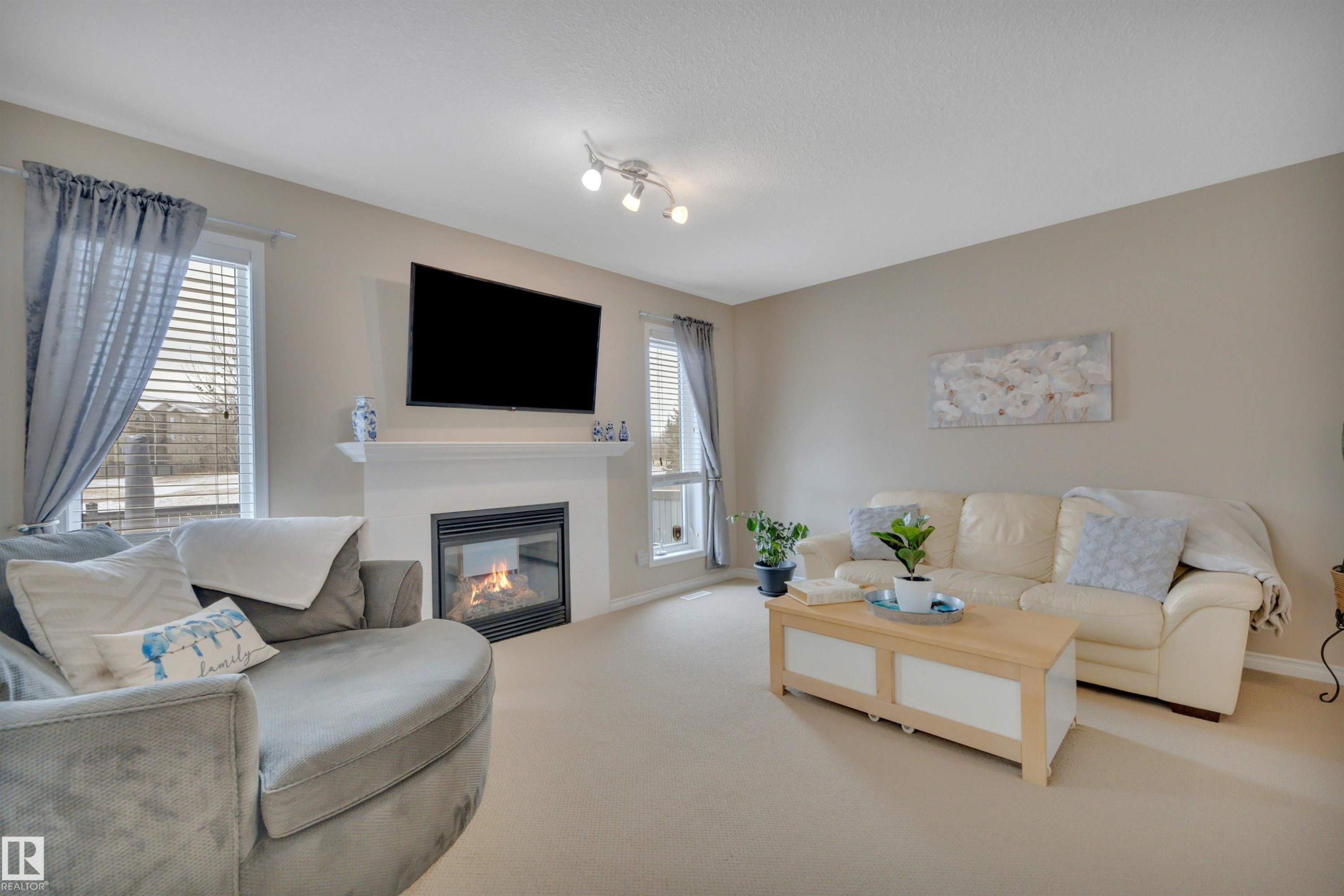 190 Keyport Circle, Leduc, AB - Indoor Photo Showing Living Room With Fireplace