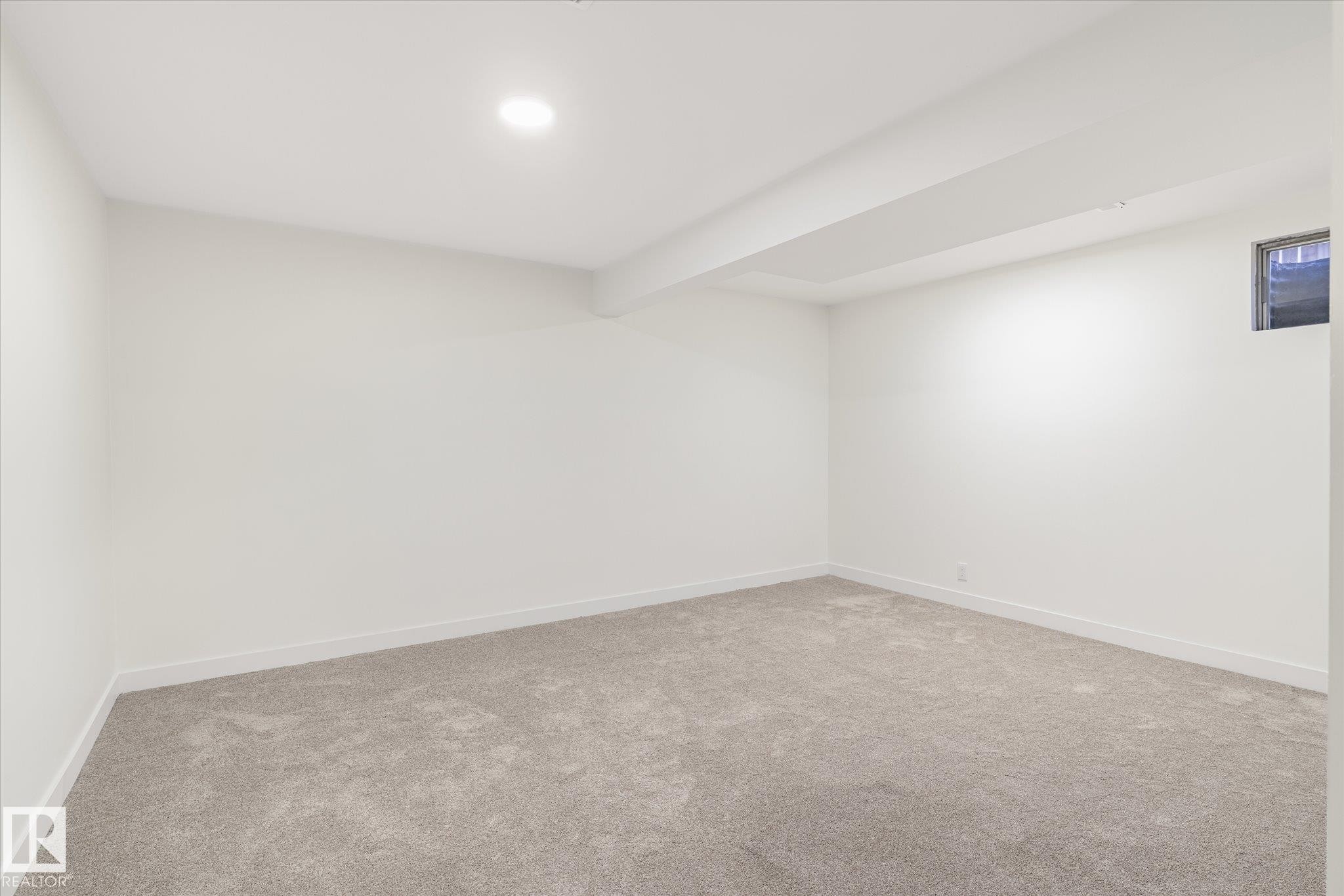 This room features plush grey carpeting, white walls, and a recessed ceiling light - 6540 184 Street, Edmonton, AB - Indoor Photo Showing Other Room