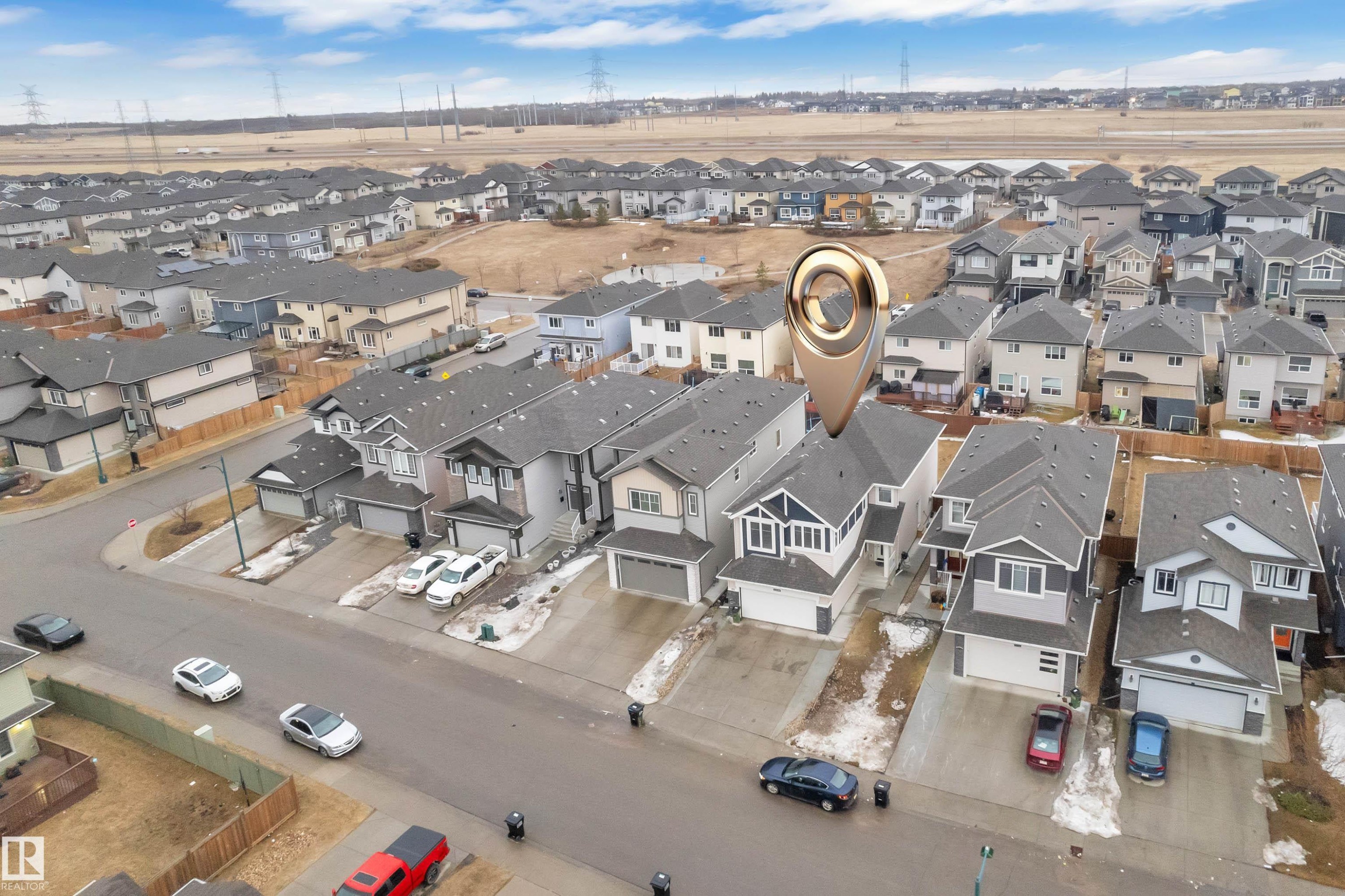A clear aerial view showcasing the property within a structured residential neighborhood, featuring a paved street and surrounding homes - 3235 13 Avenue, Edmonton, AB - Outdoor With View