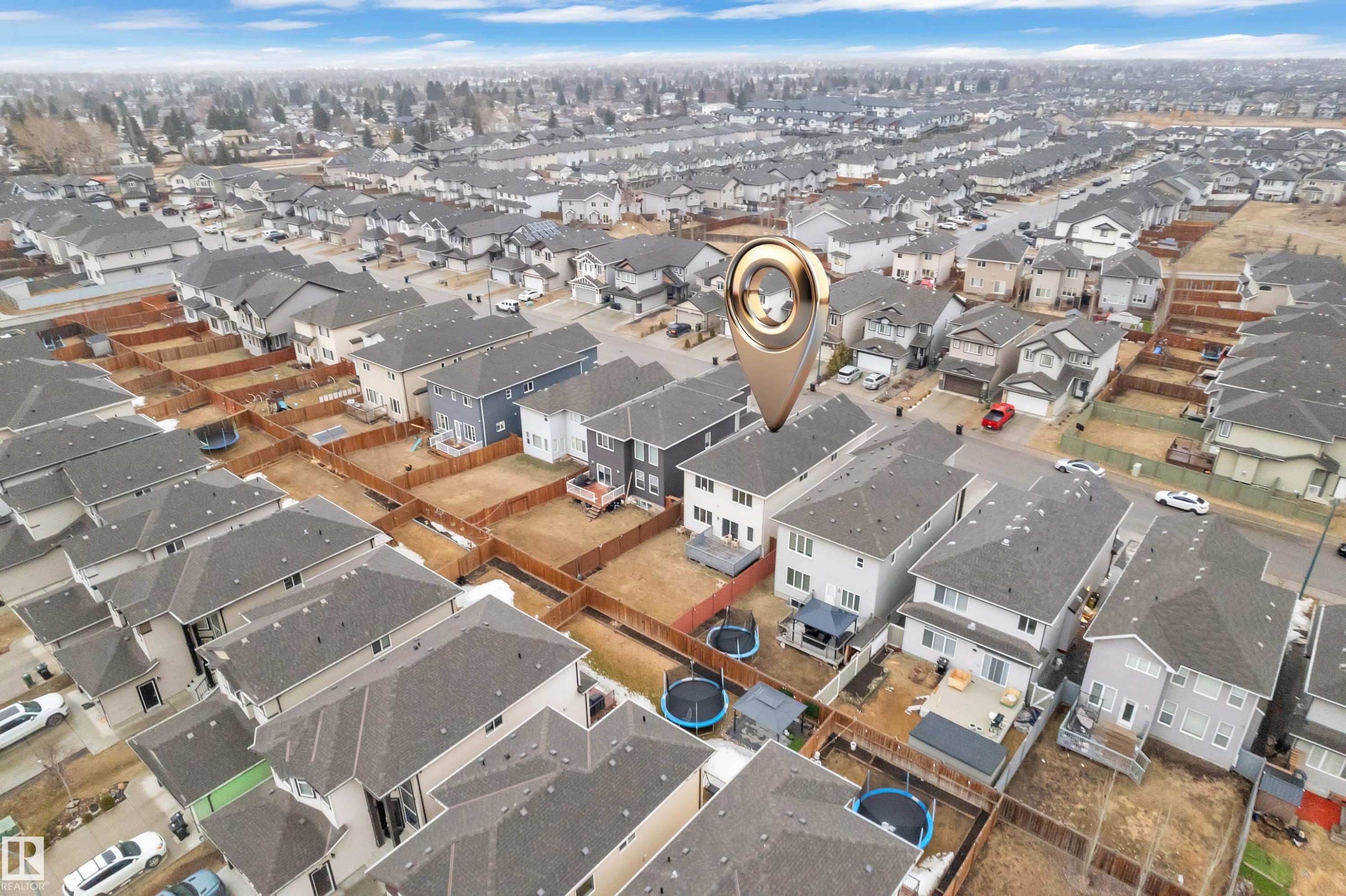 Aerial view of the property and surrounding neighborhood, featuring residential homes with grey roofs and fenced yards - 3235 13 Avenue, Edmonton, AB - Outdoor With View