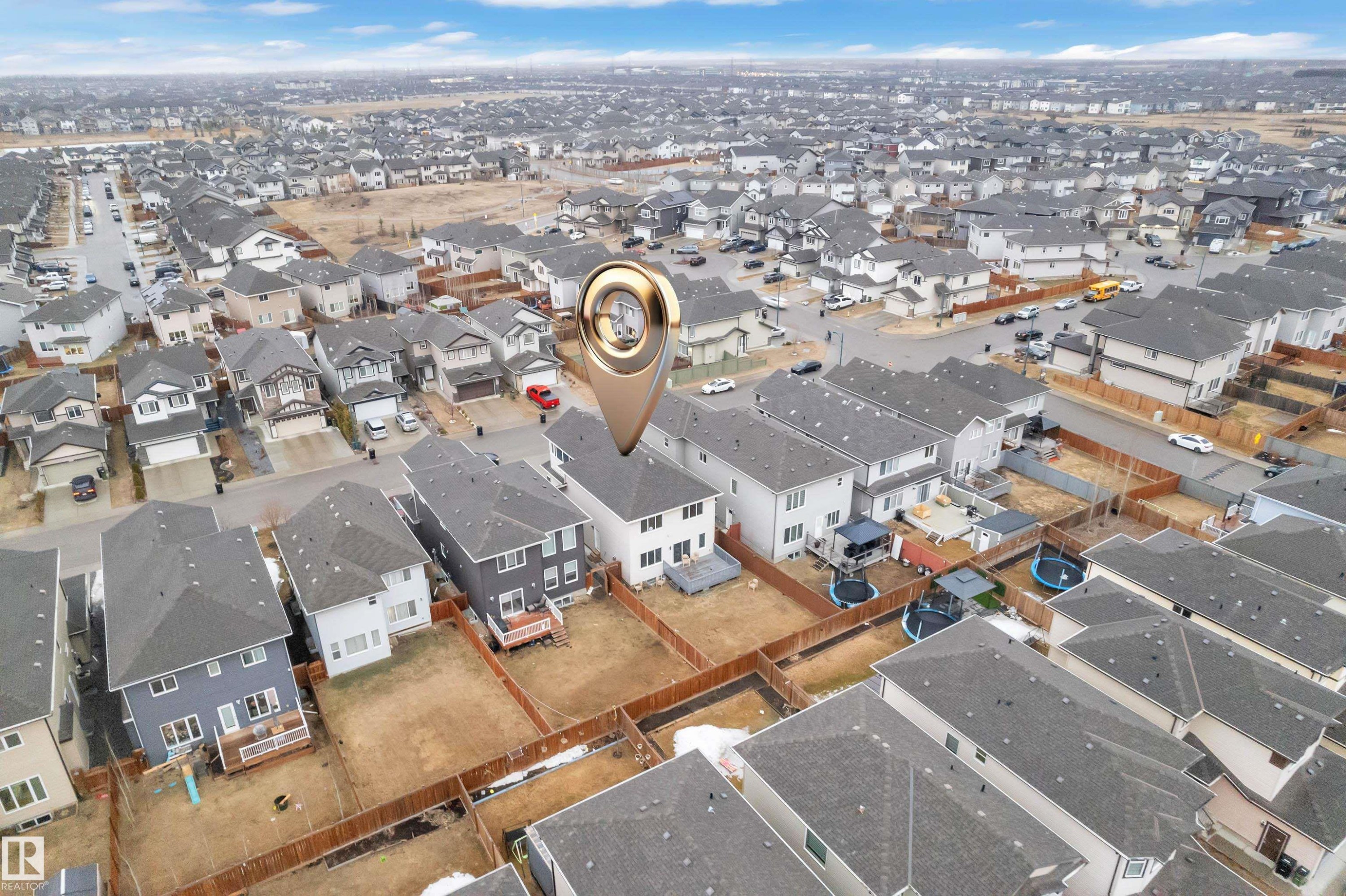 Aerial view of the property and its surrounding neighborhood, showcasing numerous residential properties with grey roofs - 3235 13 Avenue, Edmonton, AB - Outdoor With View
