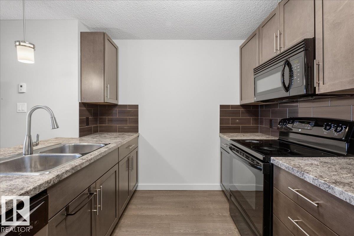 123 6084 Stanton Drive, Edmonton, AB - Indoor Photo Showing Kitchen With Double Sink