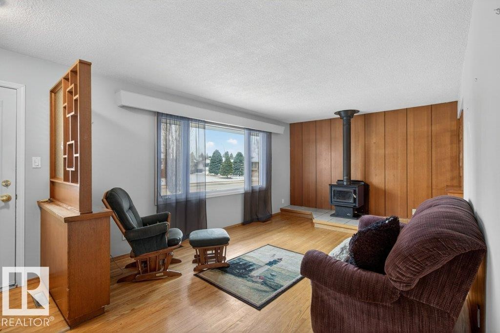 5216 89 Avenue, Edmonton, AB - Indoor Photo Showing Living Room With Fireplace