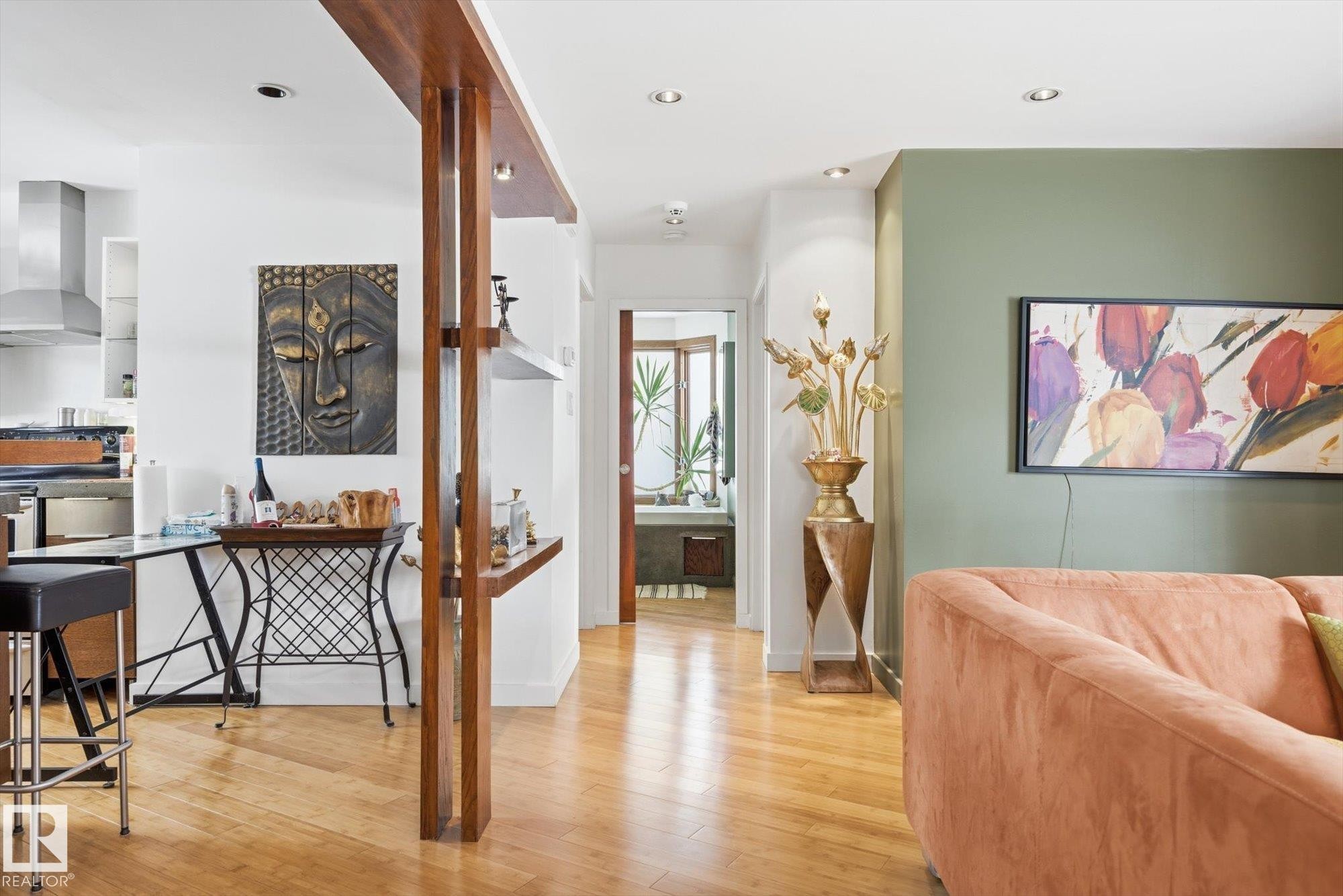 The property features light hardwood floors and recessed lighting throughout - 11026 110 Avenue, Edmonton, AB - Indoor