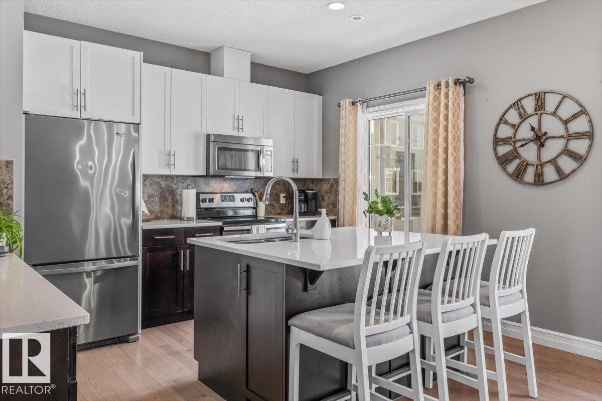 9 2003 Rabbit Hill Road, Edmonton, AB - Indoor Photo Showing Kitchen With Double Sink
