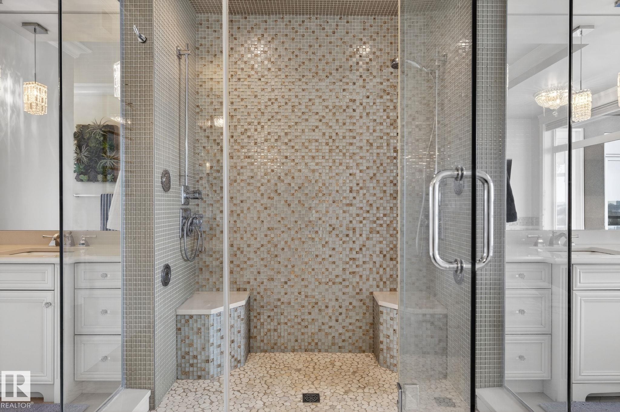 The shower features glass enclosures, mosaic tile walls, and a pebble-style floor - 1413 Woodward Crescent, Edmonton, AB - Indoor Photo Showing Bathroom