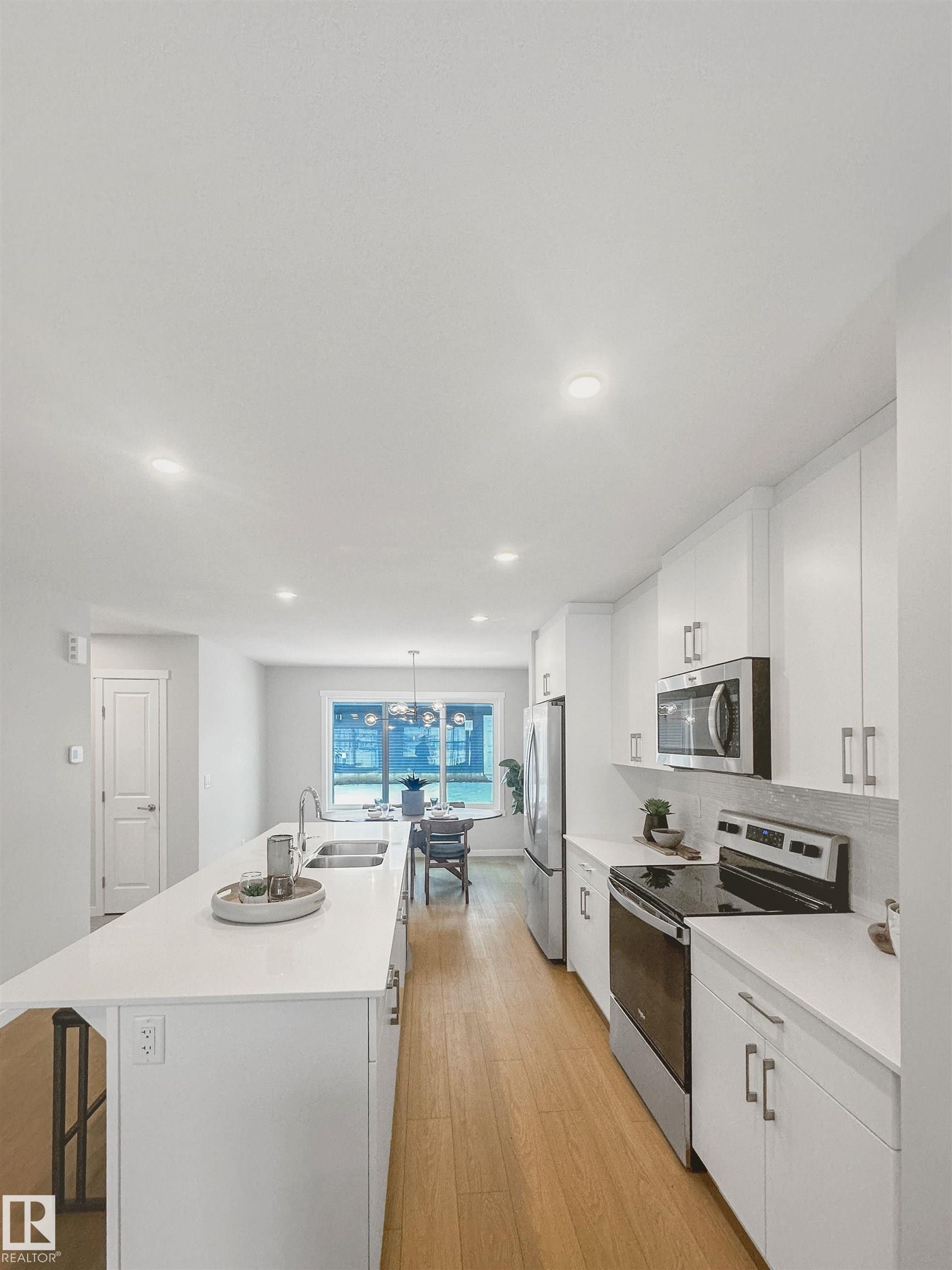 69 Raspberry Road, St. Albert, AB - Indoor Photo Showing Kitchen With Stainless Steel Kitchen With Double Sink With Upgraded Kitchen
