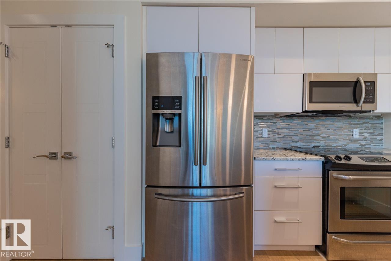 401 11969 Jasper Avenue, Edmonton, AB - Indoor Photo Showing Kitchen With Stainless Steel Kitchen