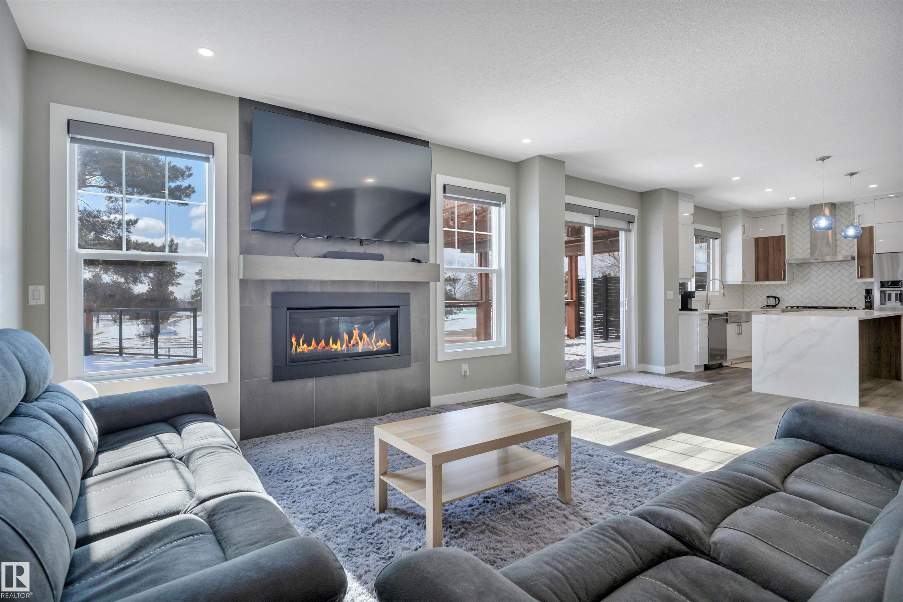 15 Promenade Point(E), Beaumont, AB - Indoor Photo Showing Living Room With Fireplace