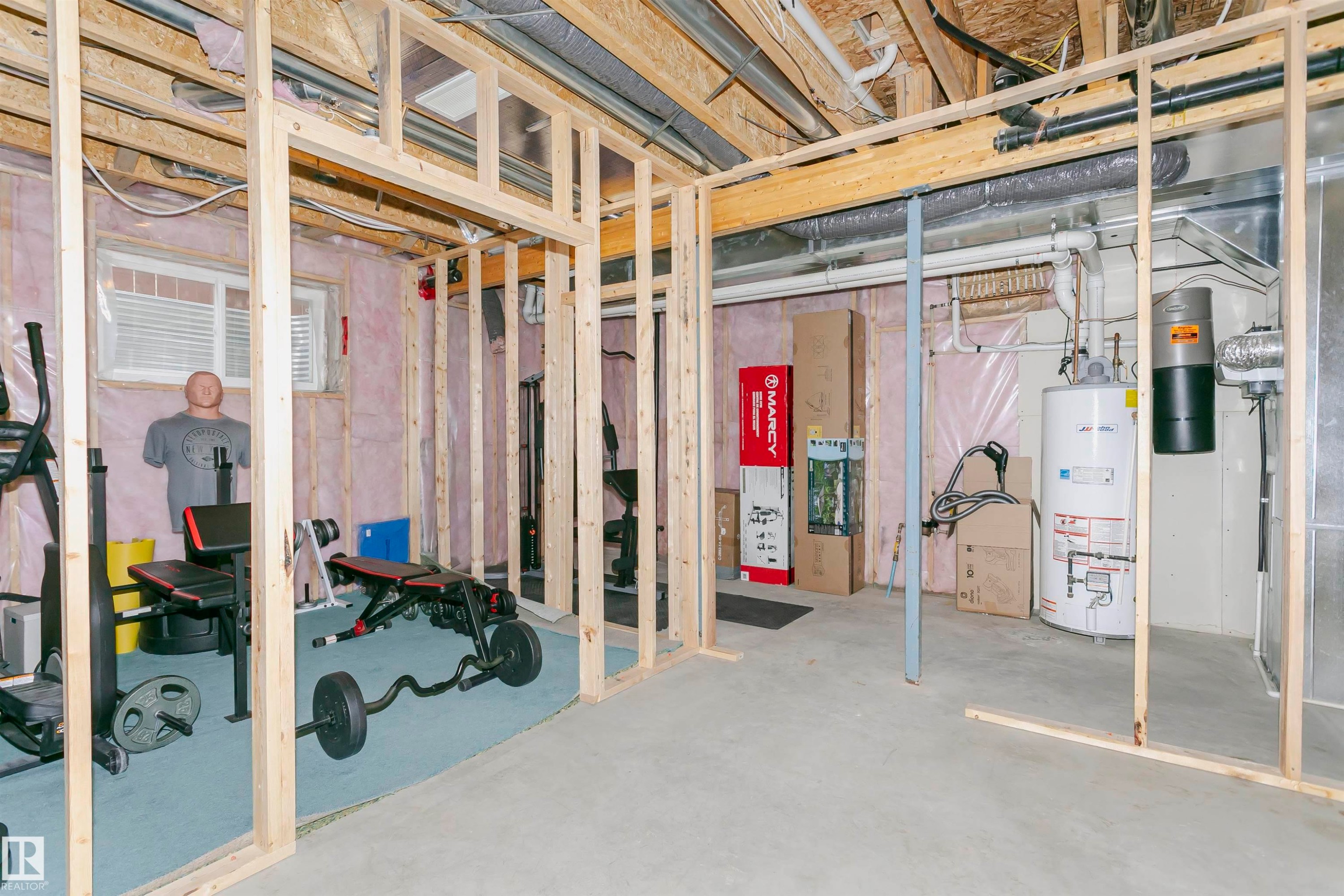 Unfinished basement area with exposed wooden framing, providing a versatile space for customization - 21807 97 Avenue, Edmonton, AB - Indoor Photo Showing Basement