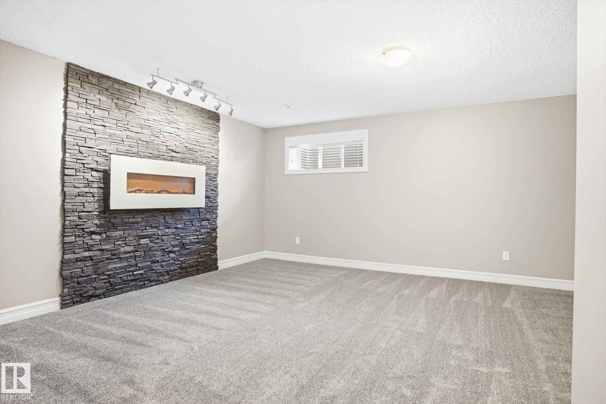6861 Cardinal Link, Edmonton, AB - Indoor Photo Showing Other Room With Fireplace