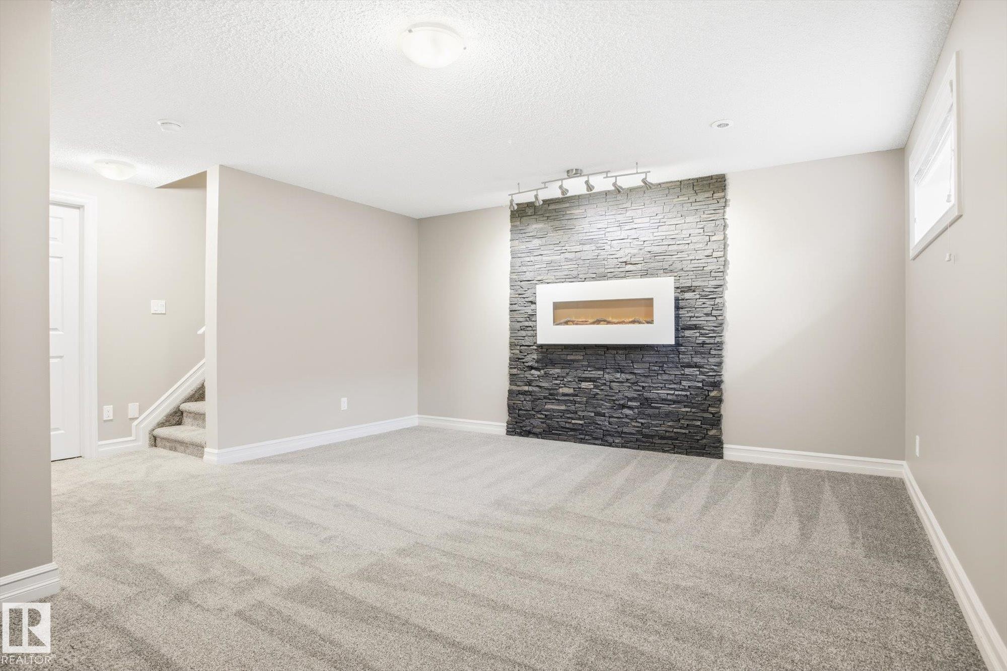 6861 Cardinal Link, Edmonton, AB - Indoor Photo Showing Other Room With Fireplace