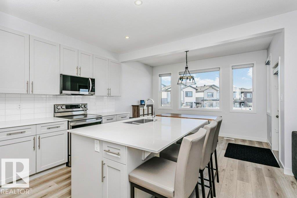 18 Elderberry Point(E), Fort Saskatchewan, AB - Indoor Photo Showing Kitchen With Double Sink With Upgraded Kitchen