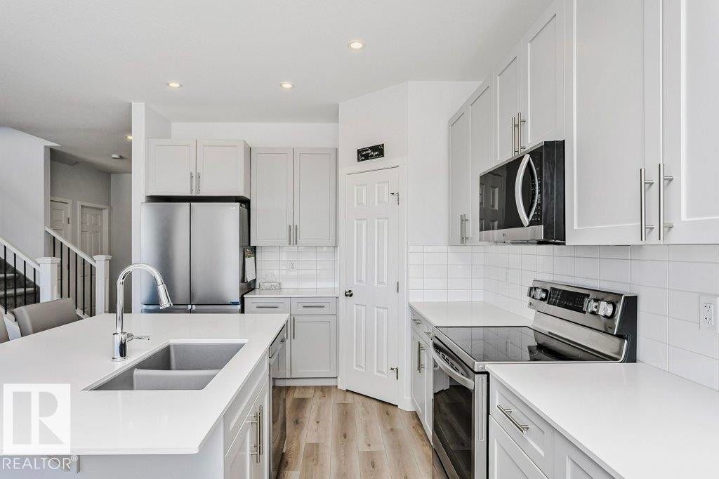 18 Elderberry Point(E), Fort Saskatchewan, AB - Indoor Photo Showing Kitchen With Double Sink With Upgraded Kitchen