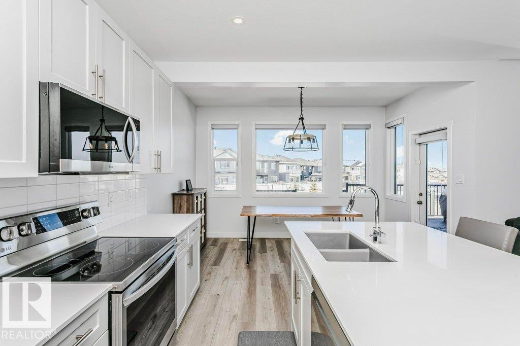 18 Elderberry Point(E), Fort Saskatchewan, AB - Indoor Photo Showing Kitchen With Double Sink With Upgraded Kitchen