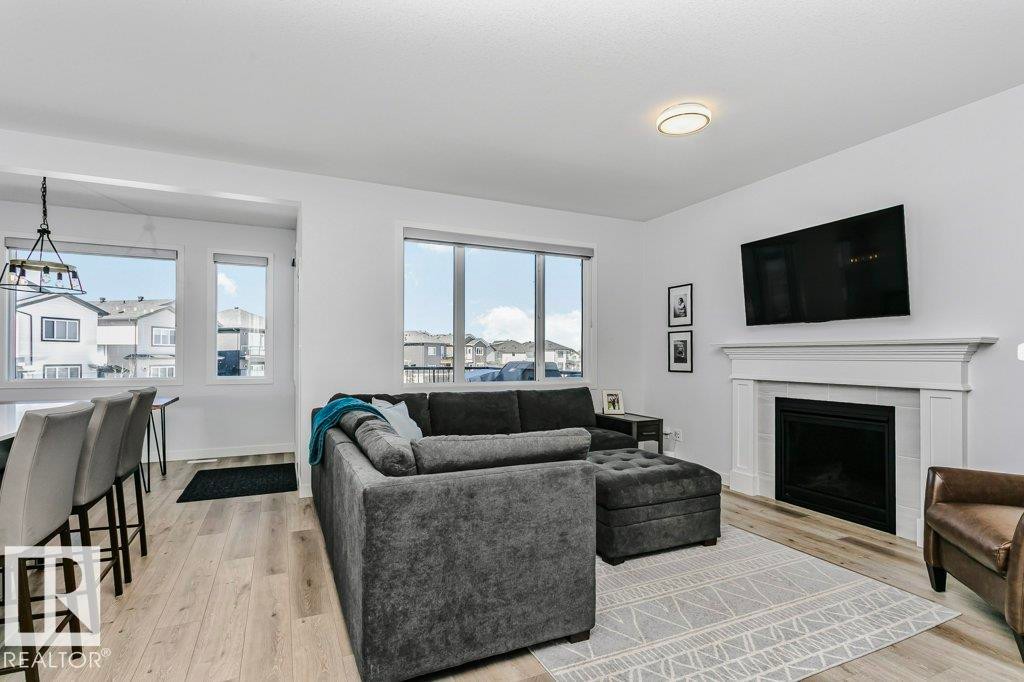 18 Elderberry Point(E), Fort Saskatchewan, AB - Indoor Photo Showing Living Room With Fireplace