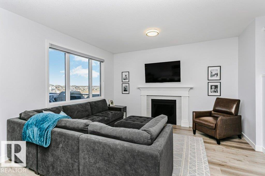 18 Elderberry Point(E), Fort Saskatchewan, AB - Indoor Photo Showing Living Room With Fireplace