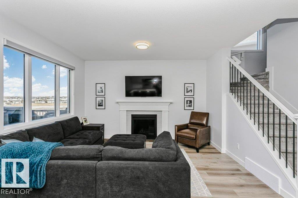 18 Elderberry Point(E), Fort Saskatchewan, AB - Indoor Photo Showing Living Room With Fireplace