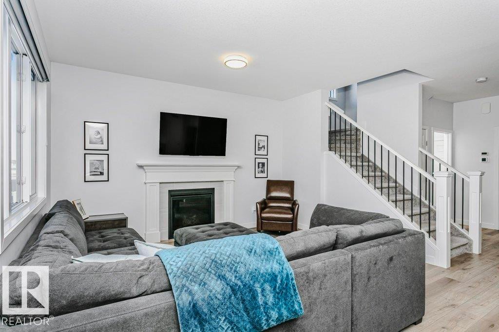 18 Elderberry Point(E), Fort Saskatchewan, AB - Indoor Photo Showing Living Room With Fireplace