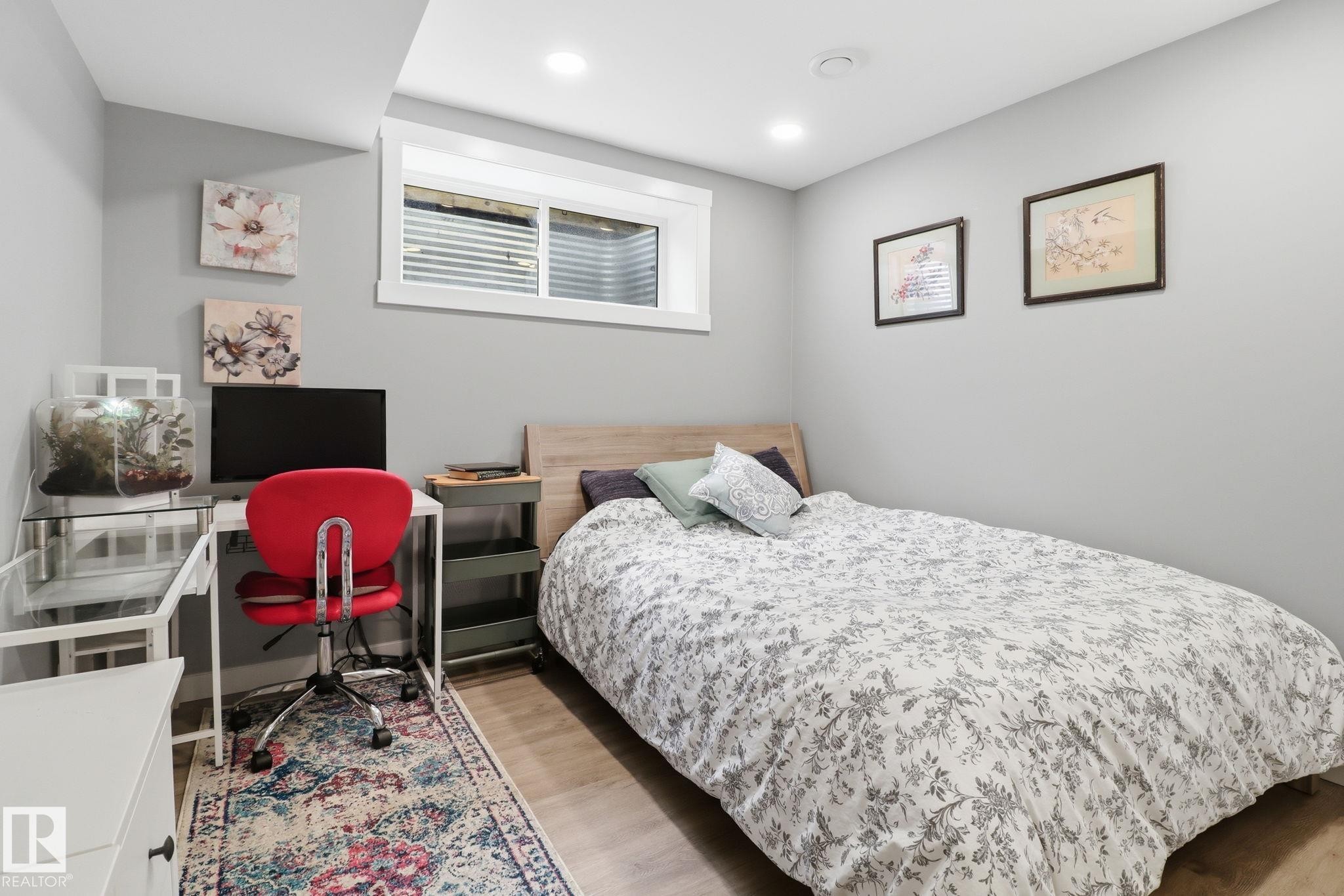 This room features light gray walls, recessed lighting, and a window with white trim - 430 Watt Boulevard, Edmonton, AB - Indoor Photo Showing Bedroom
