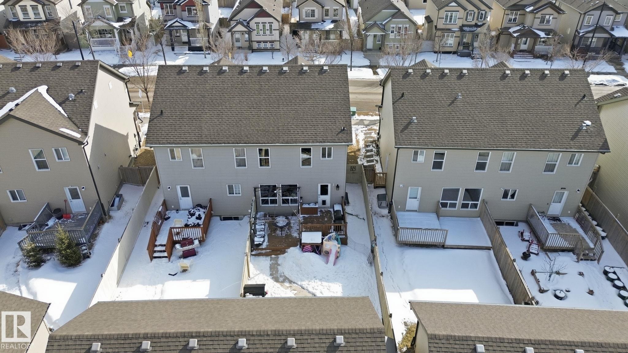 The property features a private fenced yard with a deck, offering outdoor space - 430 Watt Boulevard, Edmonton, AB - Outdoor