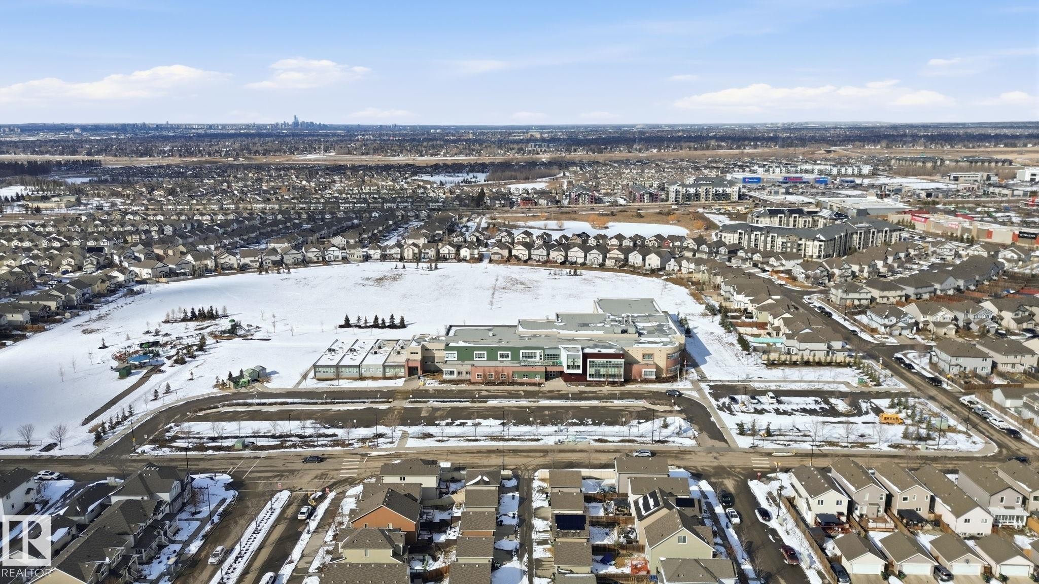 Aerial view showcasing the property's surrounding neighborhood with residential developments and open spaces - 430 Watt Boulevard, Edmonton, AB - Outdoor With View