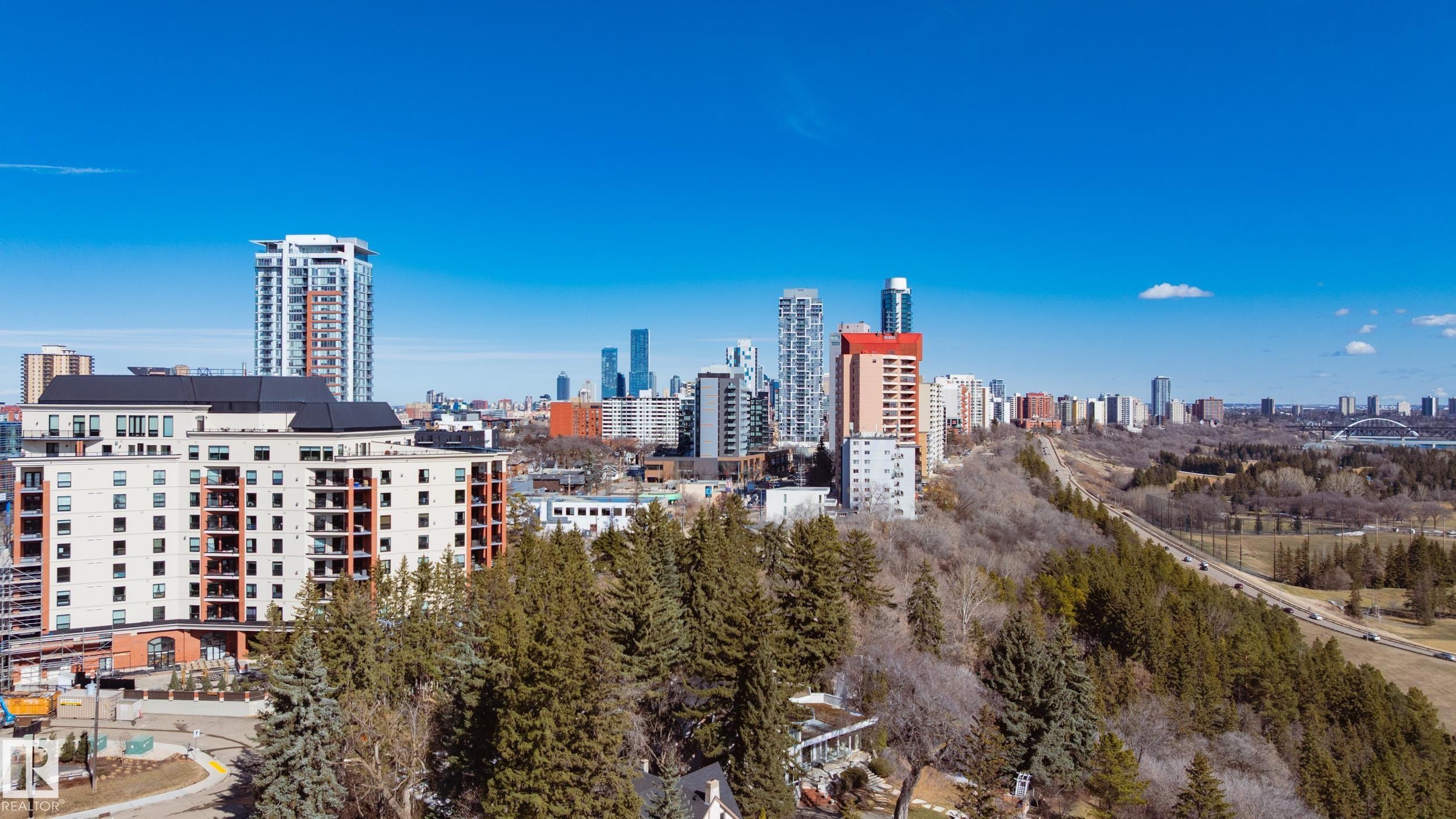 The property is situated in a vibrant urban setting, surrounded by residential buildings and established green spaces - 206 10108 125 Street, Edmonton, AB - Outdoor With View