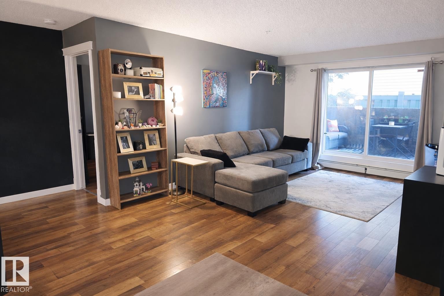 118 2430 Guardian Road, Edmonton, AB - Indoor Photo Showing Living Room