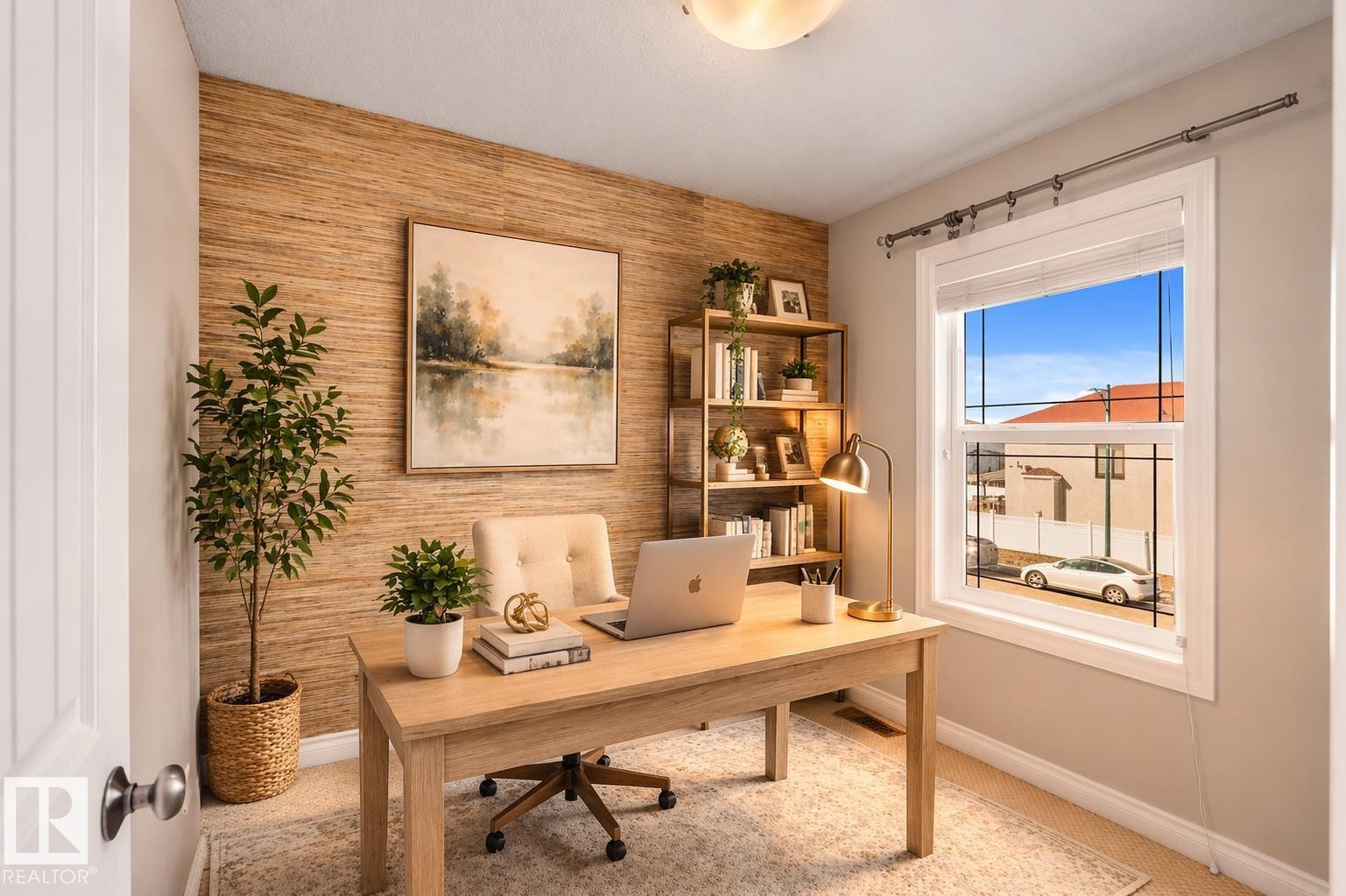 This versatile room features a window providing natural light, a textured accent wall, and a light-colored carpet - 16419 53 Street, Edmonton, AB - Indoor Photo Showing Office