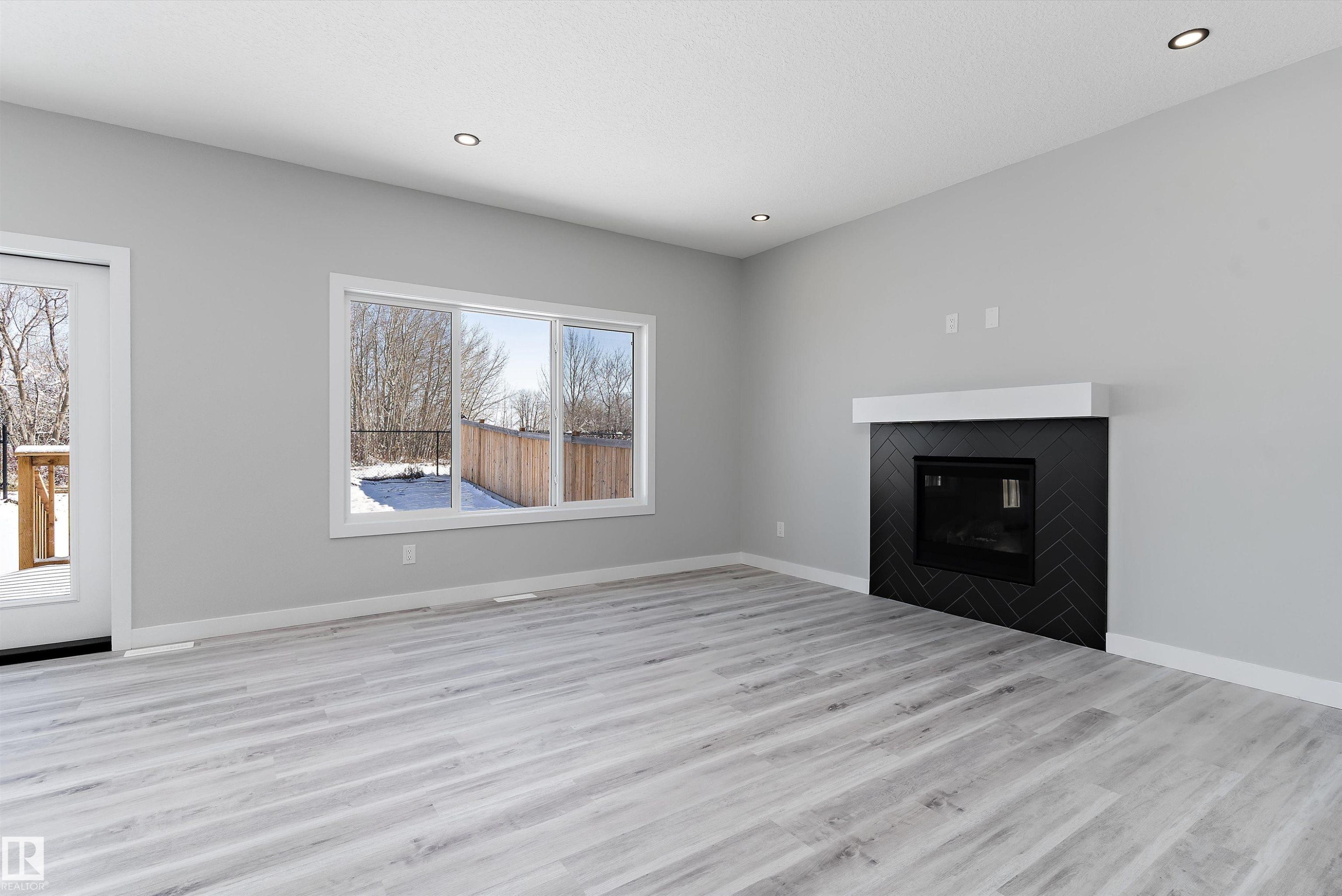 36 Maple Crescent, Gibbons, AB - Indoor Photo Showing Living Room With Fireplace