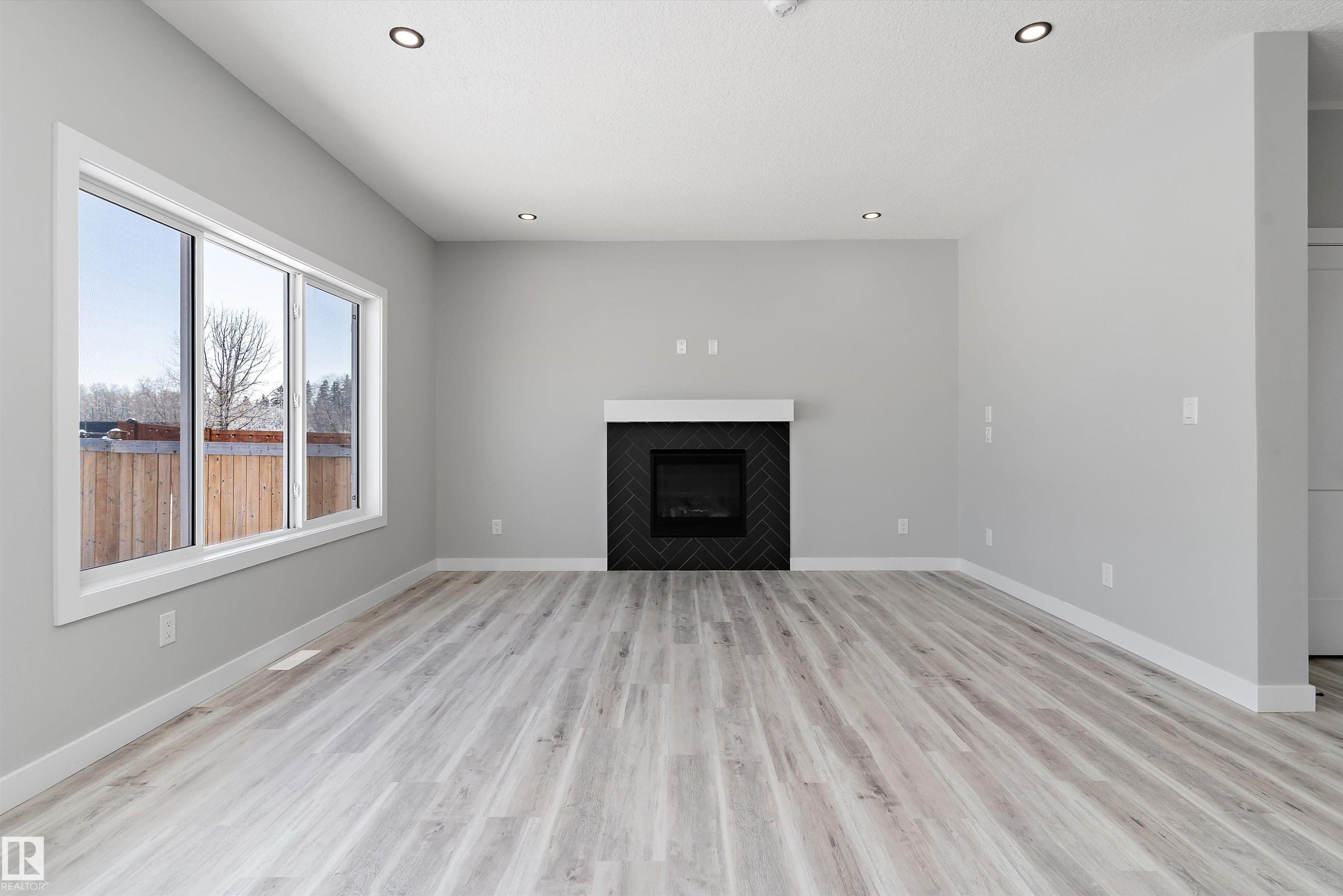36 Maple Crescent, Gibbons, AB - Indoor Photo Showing Living Room With Fireplace