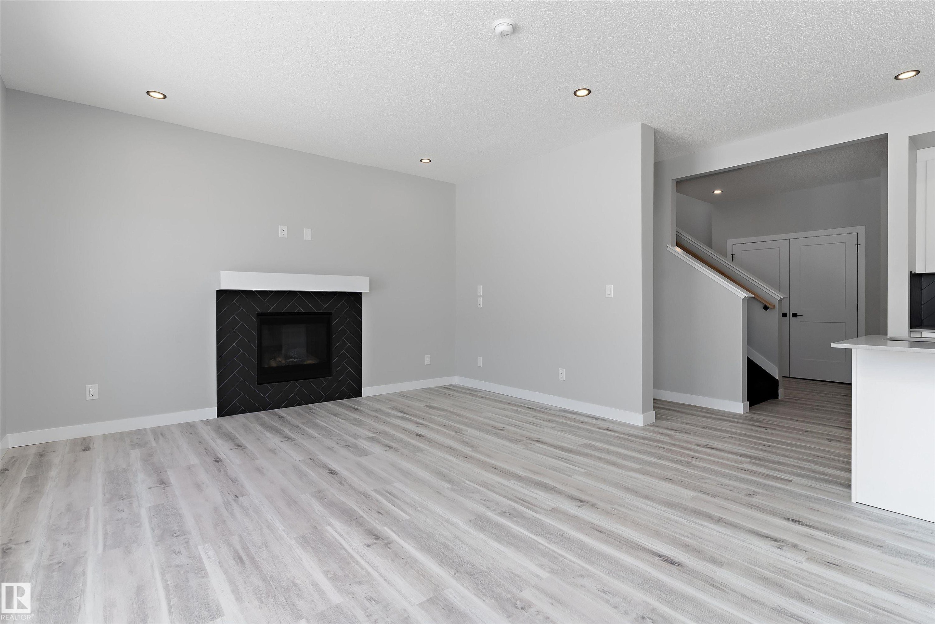 36 Maple Crescent, Gibbons, AB - Indoor Photo Showing Living Room With Fireplace