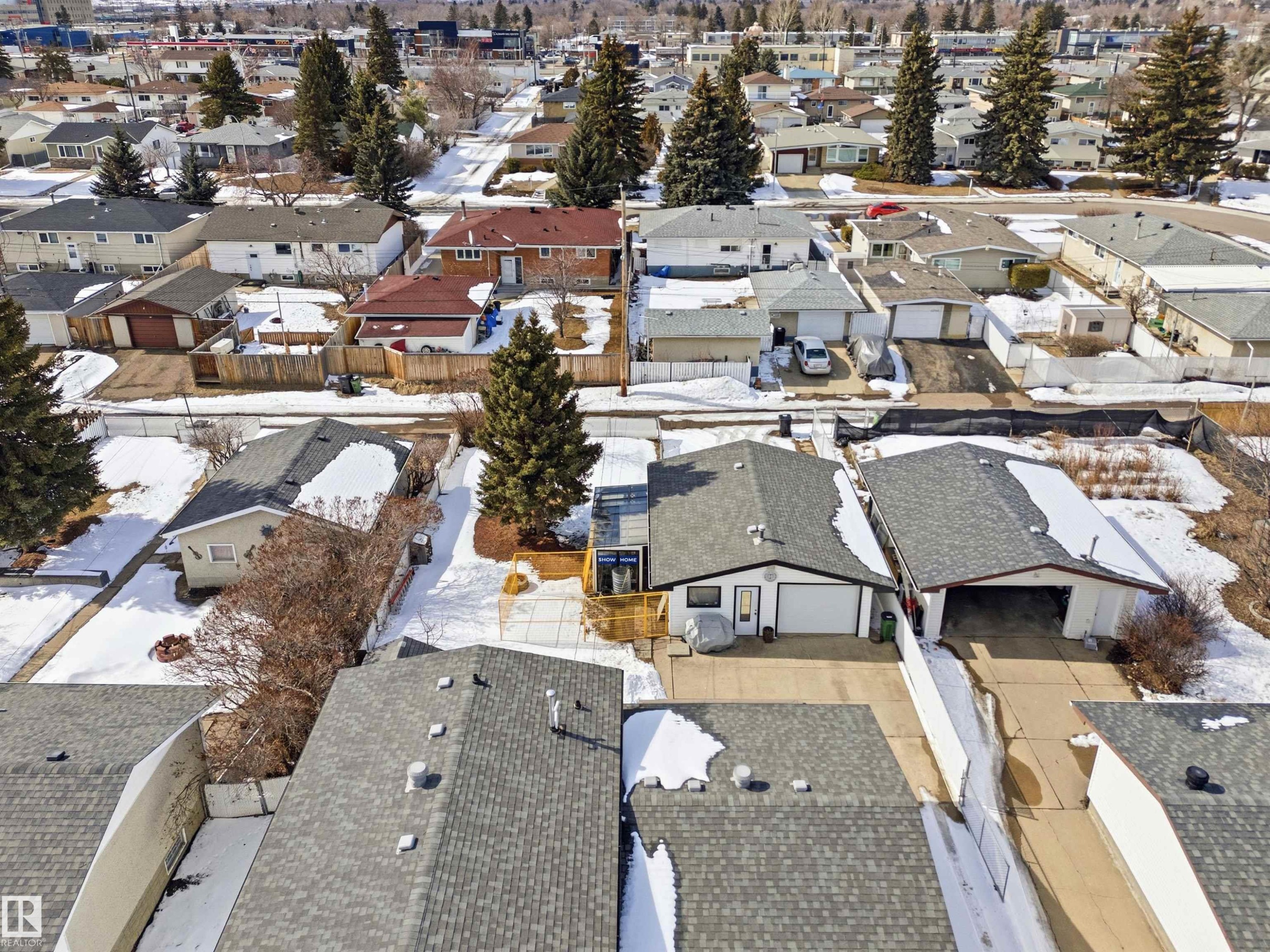 This property features a single-story dwelling with a grey roof and an attached garage - 12904 95 Street, Edmonton, AB - Outdoor With View