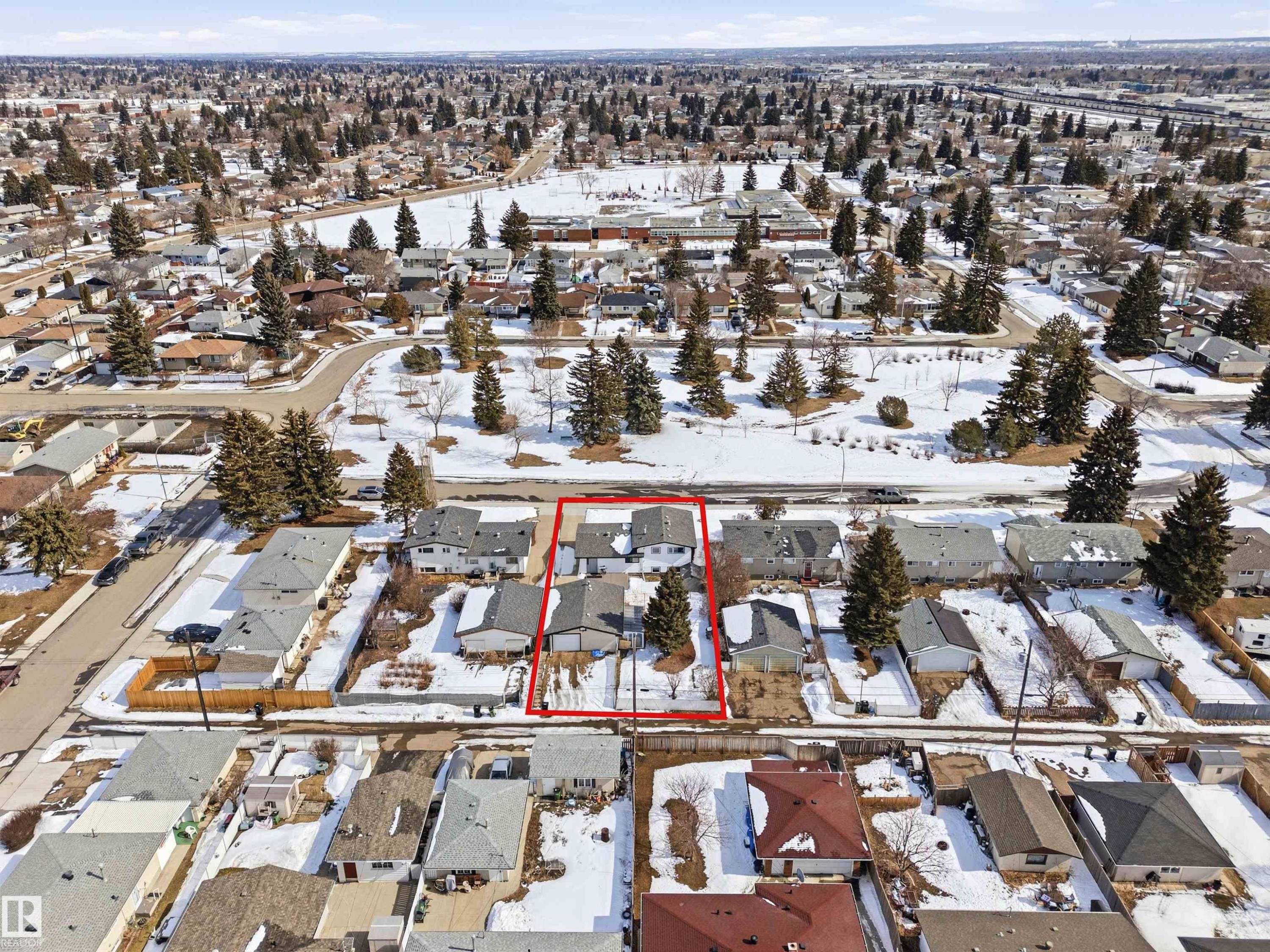 This aerial view showcases the property within a well-established residential neighborhood, characterized by a mix of single-story and multi-story homes - 12904 95 Street, Edmonton, AB - Outdoor With View