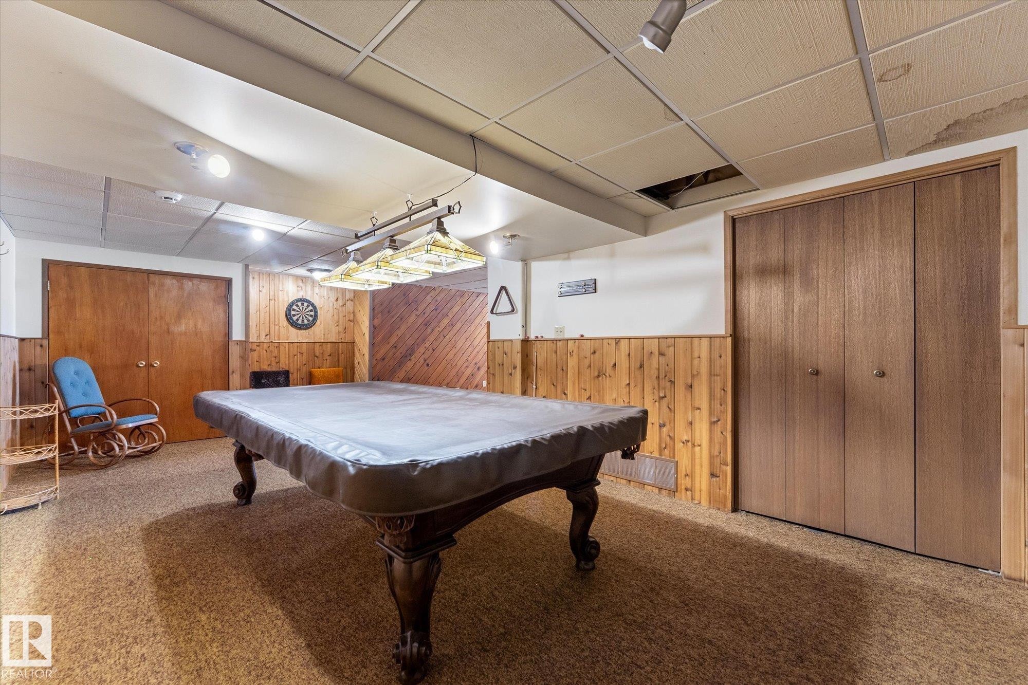 Recreation room featuring wood-finish paneling, drop ceiling, recessed lighting, and wall-to-wall carpeting - 25750 18 Street, Edmonton, AB - Indoor Photo Showing Other Room