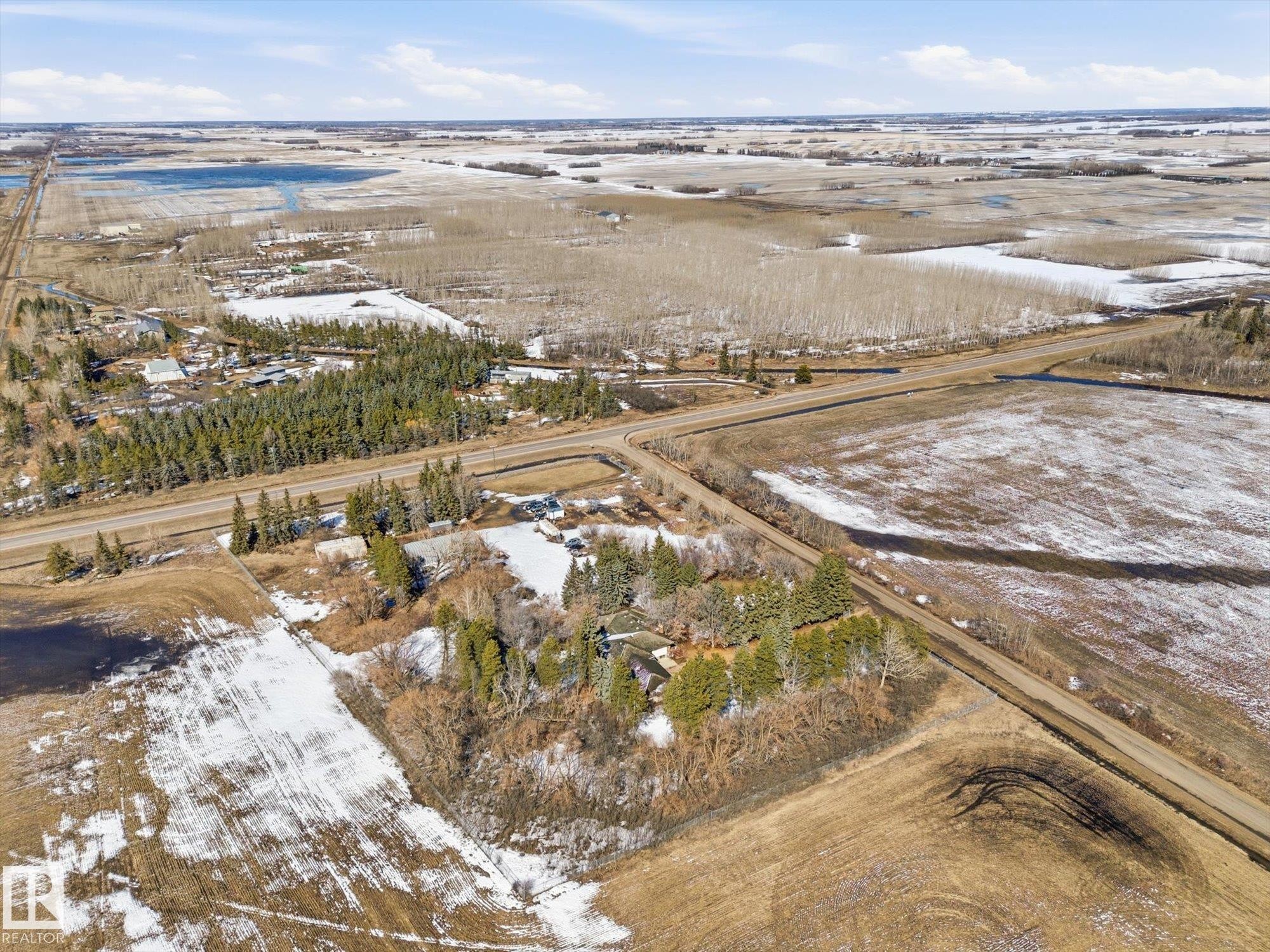 Aerial perspective showcasing a parcel of land with a treed area - 25750 18 Street, Edmonton, AB - Outdoor With View