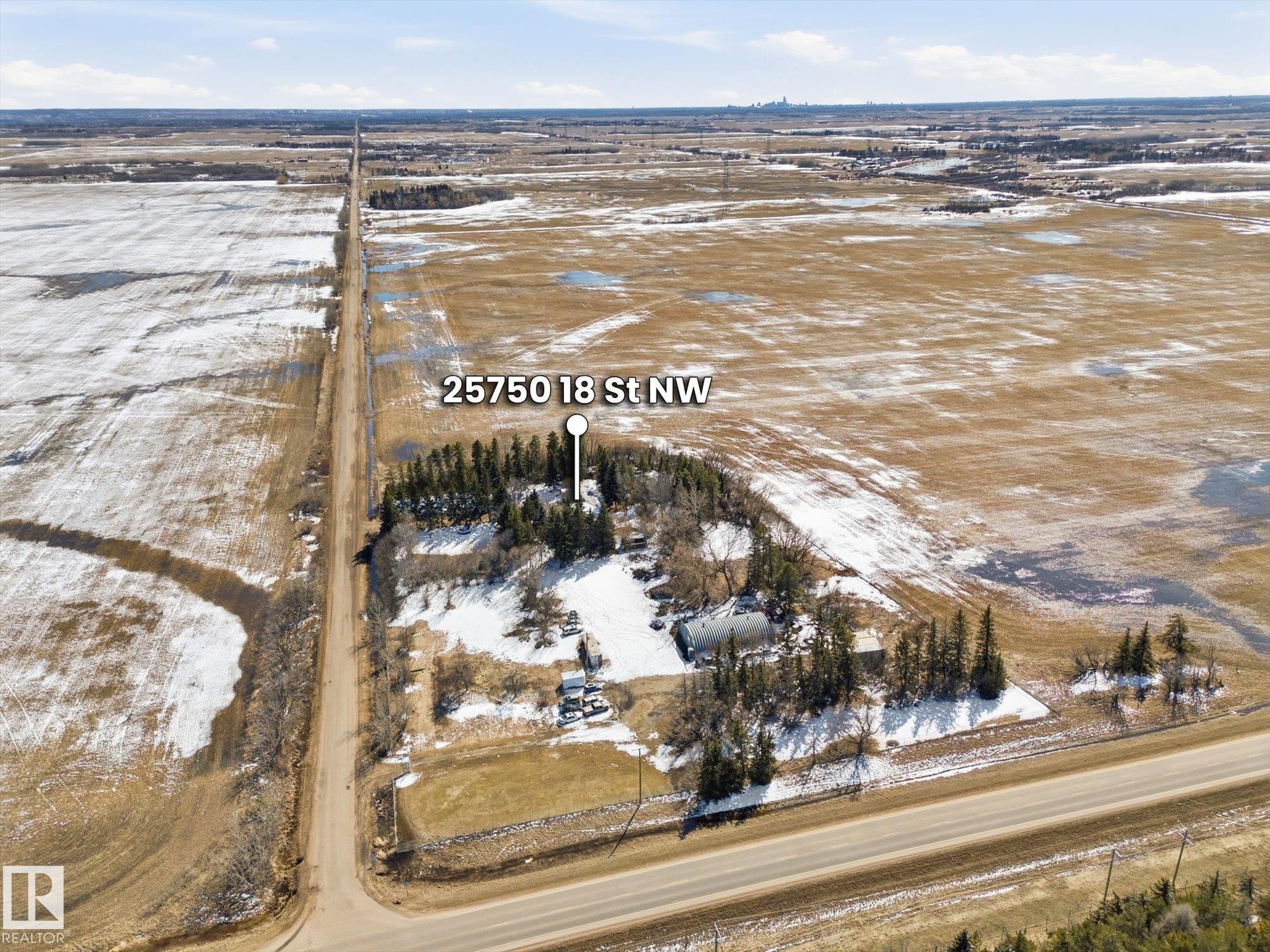 Rural property featuring a principal residence, secondary structures, and extensive surrounding land - 25750 18 Street, Edmonton, AB - Outdoor With View
