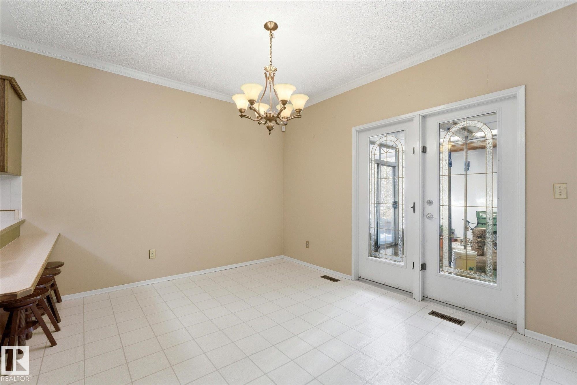 Dining area featuring white ceramic tile flooring and light beige walls - 25750 18 Street, Edmonton, AB - Indoor Photo Showing Other Room