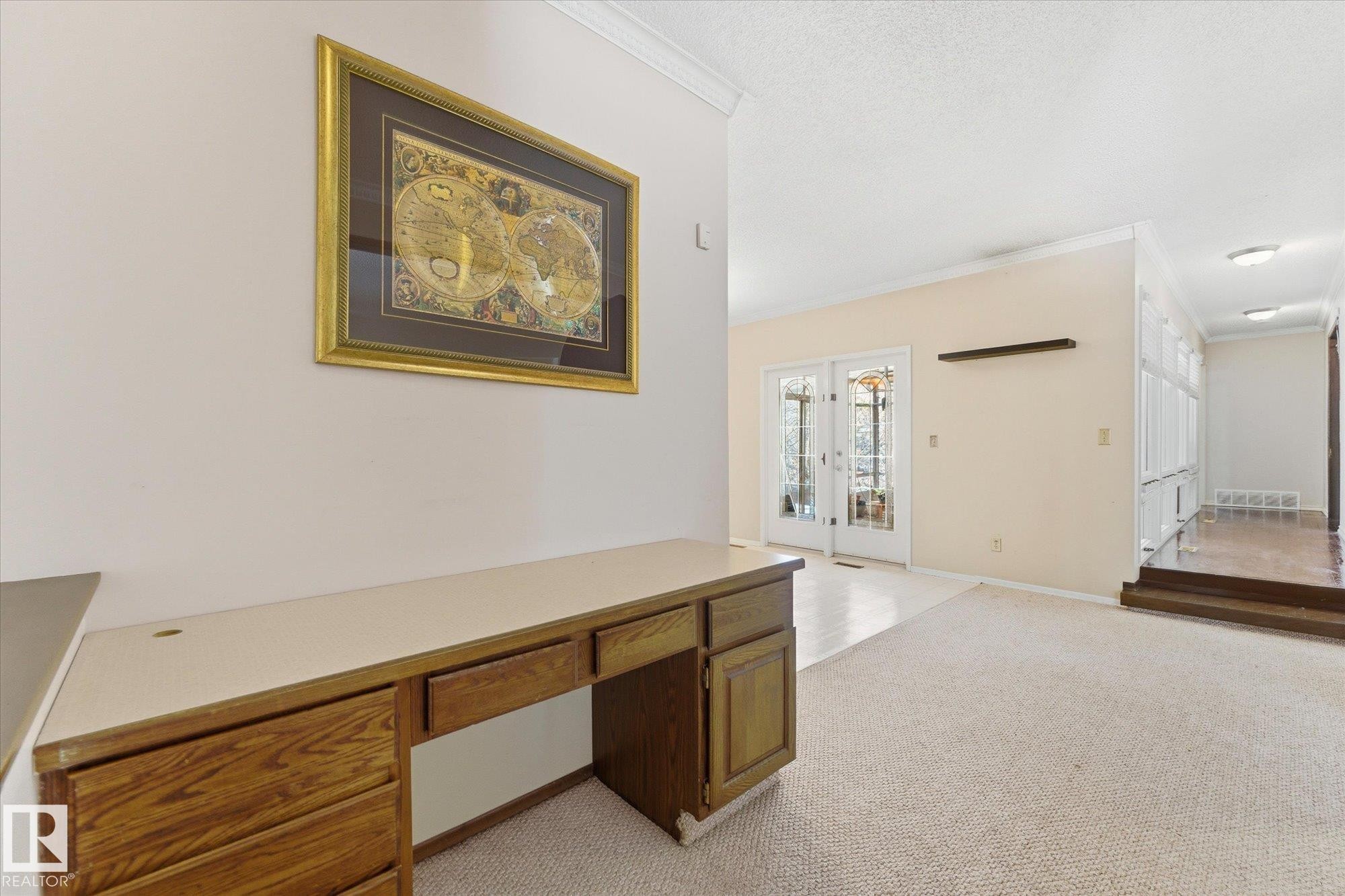 Built-in wood-finish desk with storage drawers - 25750 18 Street, Edmonton, AB - Indoor Photo Showing Other Room