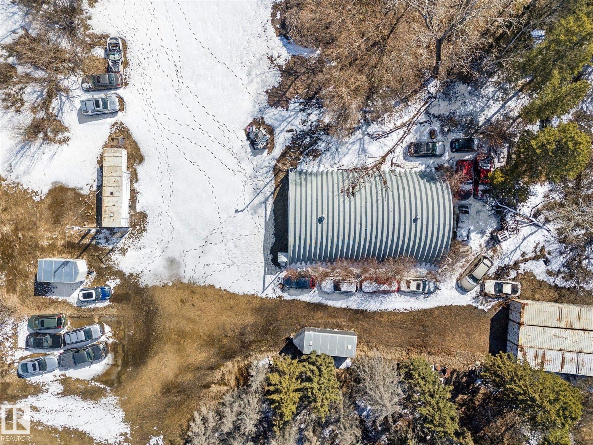 Quonset hut style structure with a corrugated metal roof - 25750 18 Street, Edmonton, AB - Outdoor