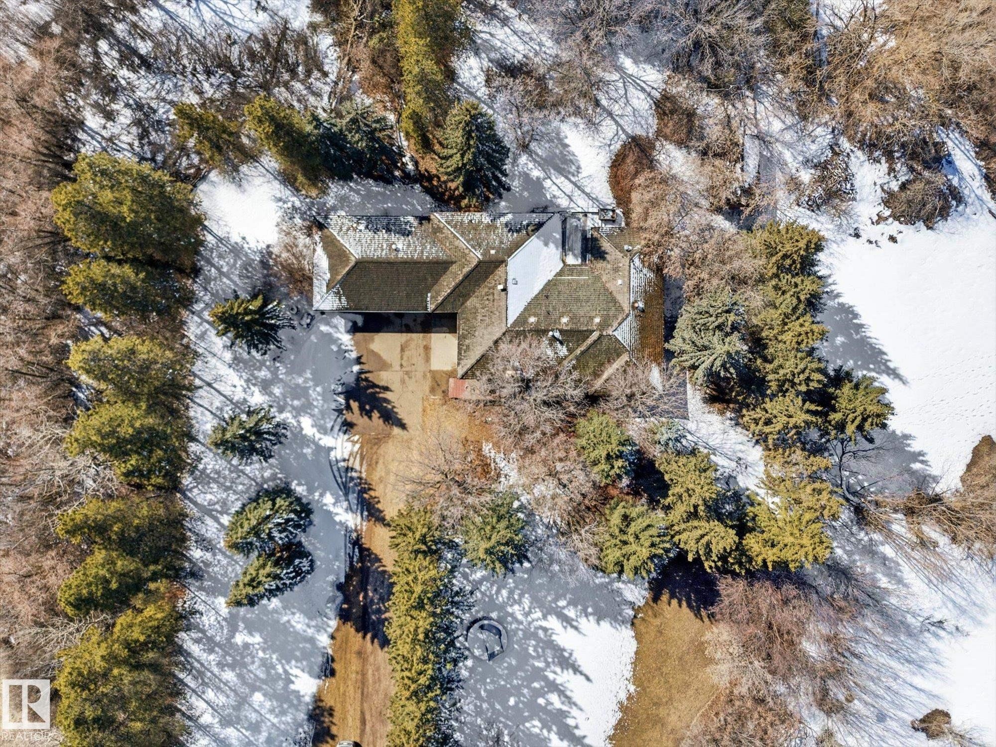 Property featuring a multi-gabled roofline and an extensive private driveway - 25750 18 Street, Edmonton, AB - Outdoor