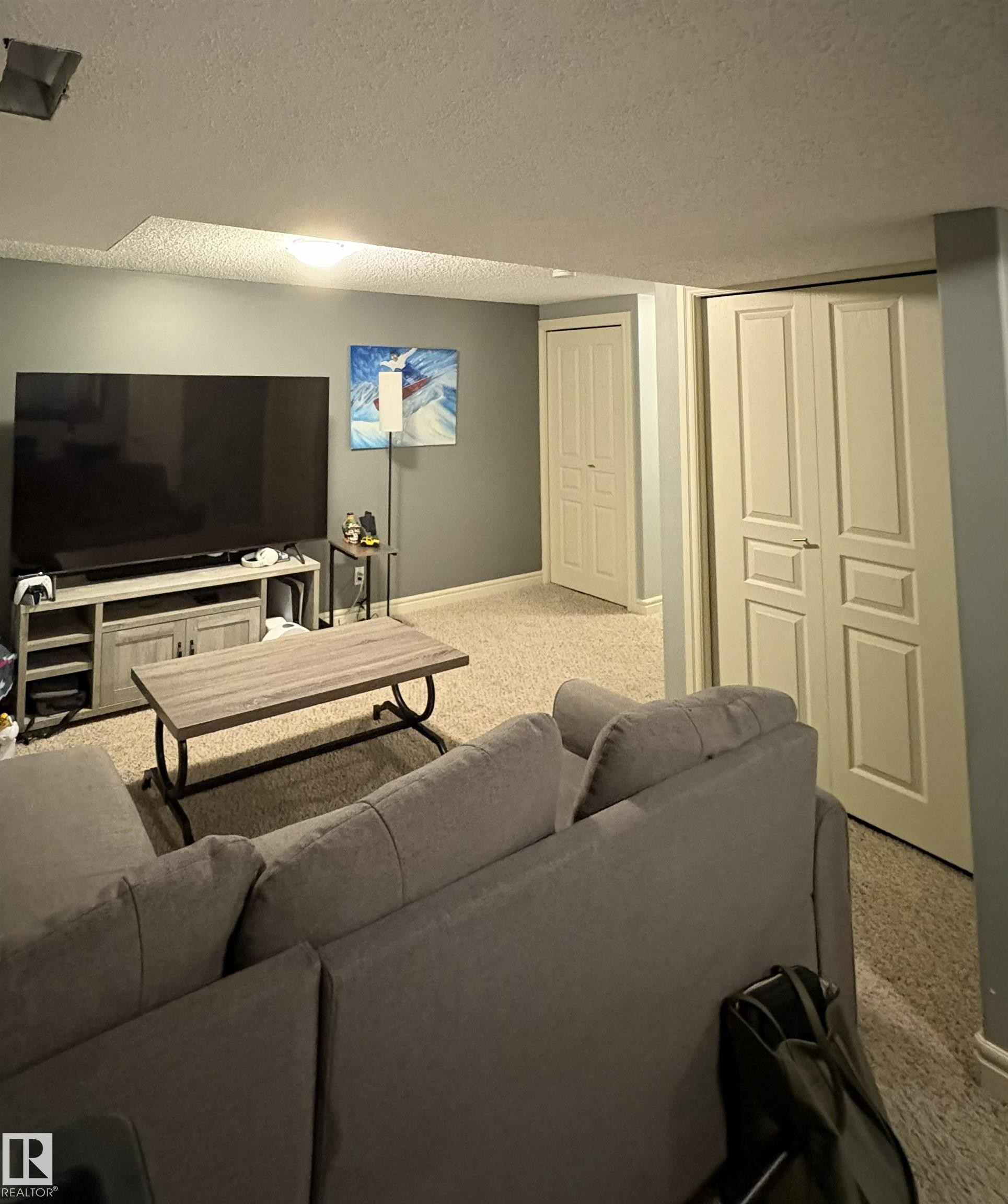 Carpeted living space with light gray walls - 79 Akinsdale Gardens, St. Albert, AB - Indoor